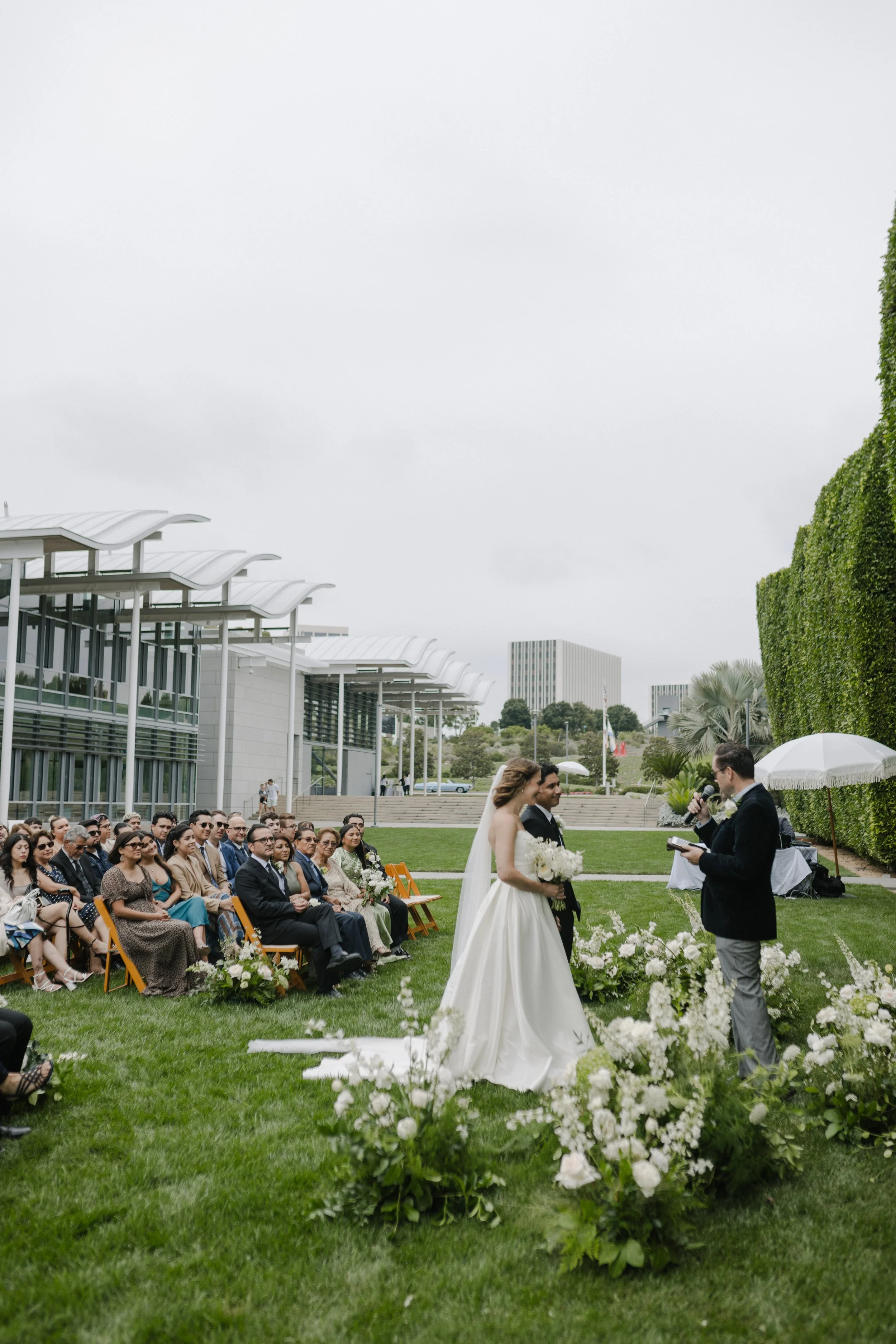 Laurie’s customers, Fernando and Kate embracing by the lake on their wedding day.