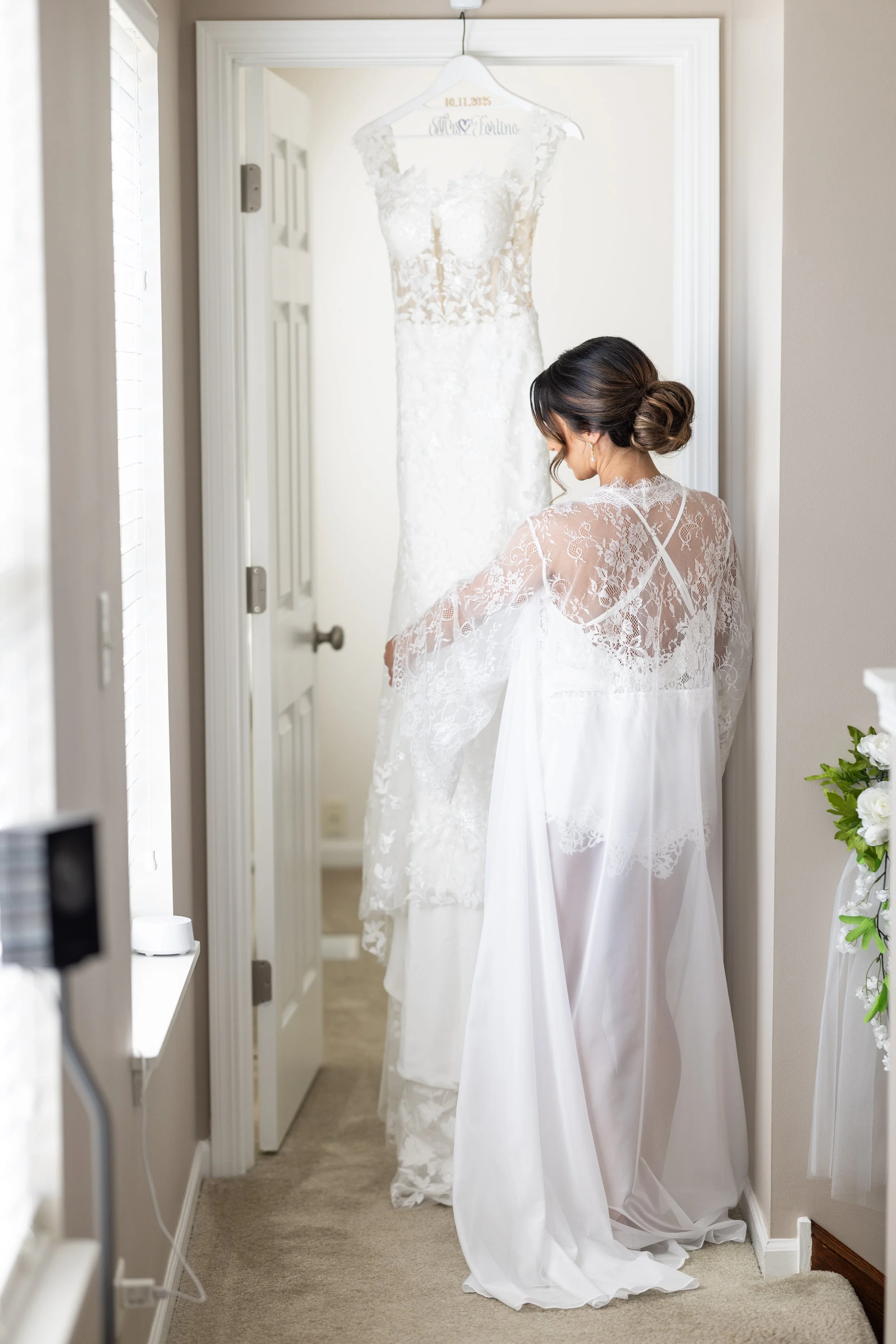 Dana in her get ready robe prior to getting in her wedding gown.
