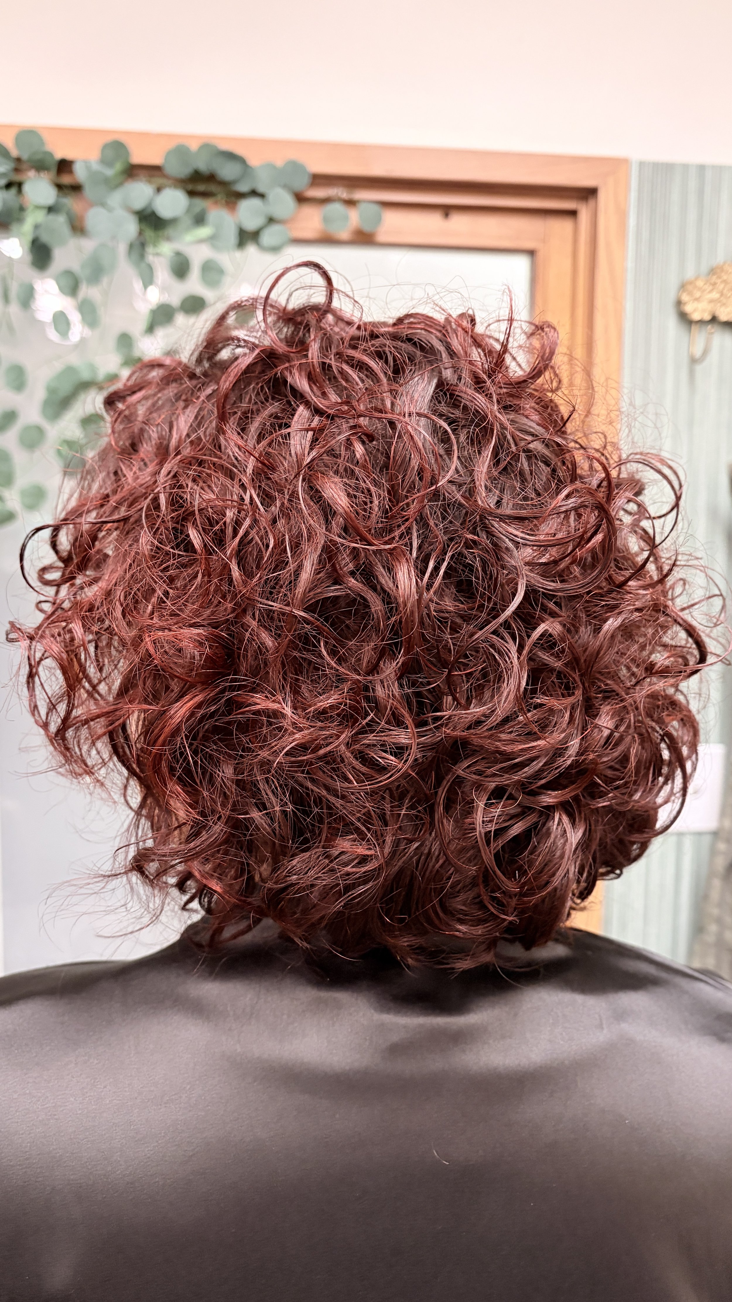 Burgandy red and wine red hair color with very curly short hair