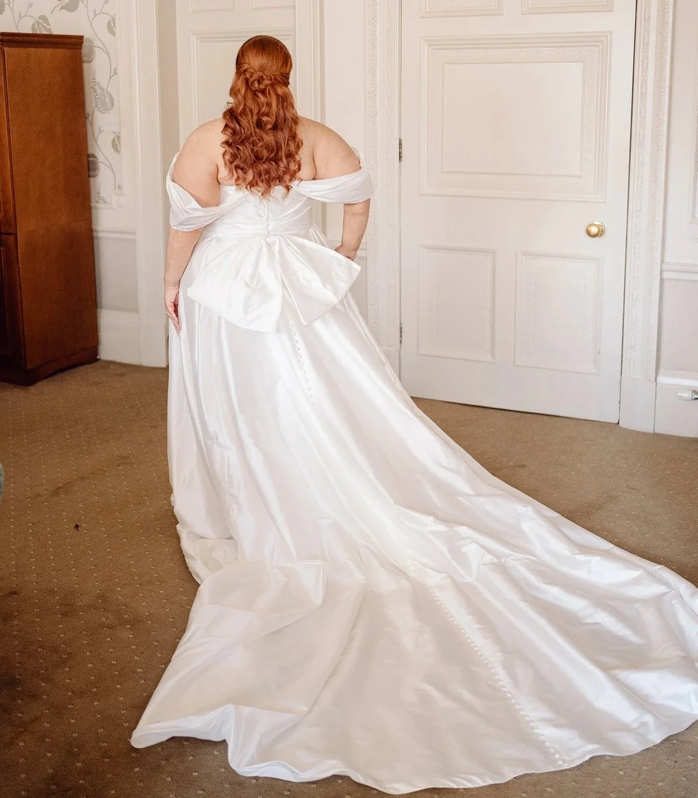 red haired bride with long, silk wedding gown
