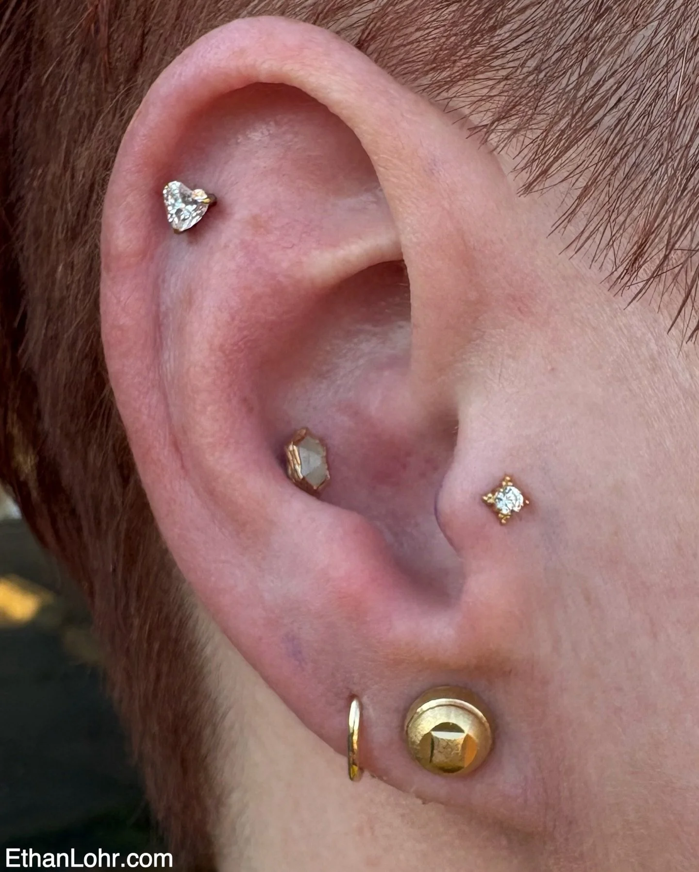 This wonderful client came in with a blank ear and some trust. Well it was worth it bc she left with this amazing set up! 
We used a &ldquo;pump up the volume&rdquo; with an aquamarine set in yellow gold from @buddhajewelryofficial in her conch pierc