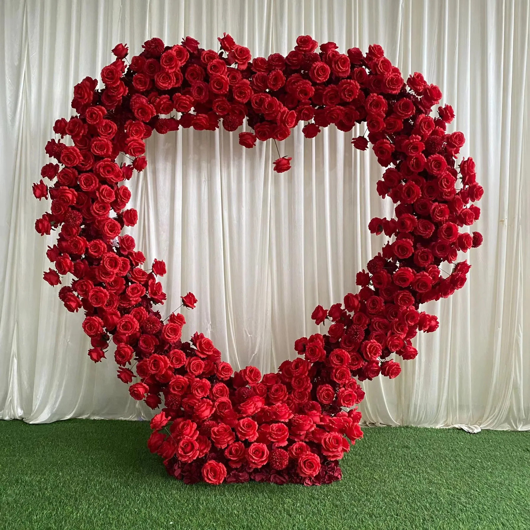 Rose Heart:  A specialty heart-shaped rose wall for photo ops and romantic themes - perfect for proposals, weddings, or Valentine events. 