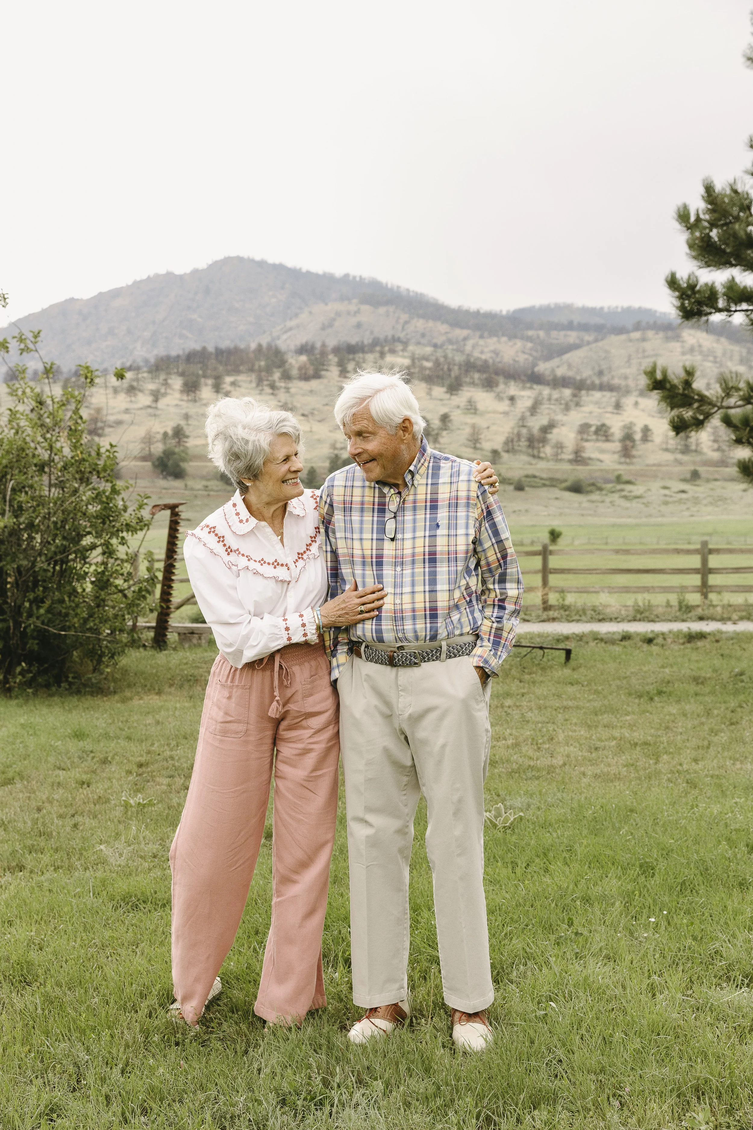 elderly couple embrace