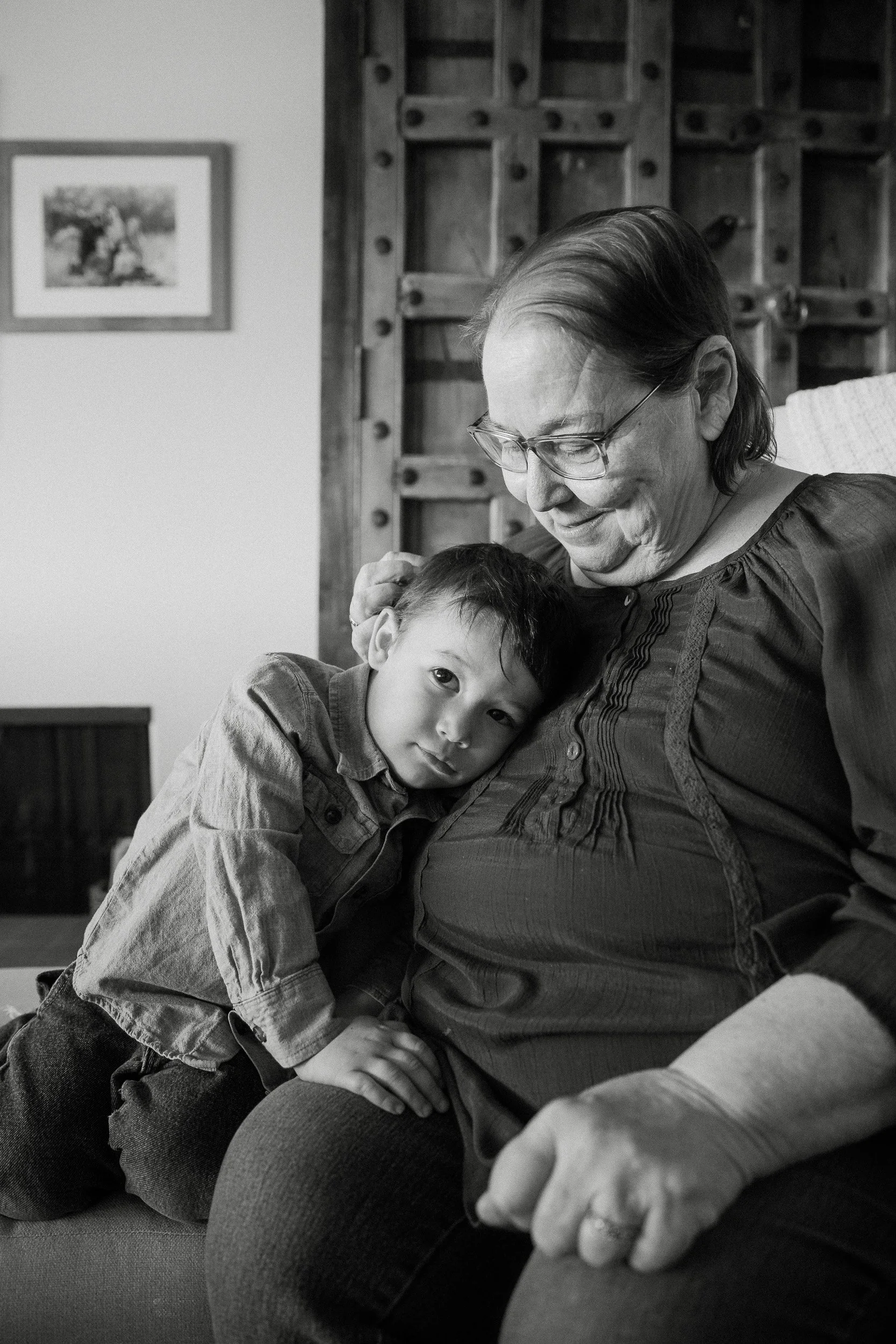  grammy and grandchild embrace during a family photo session in tucson 
