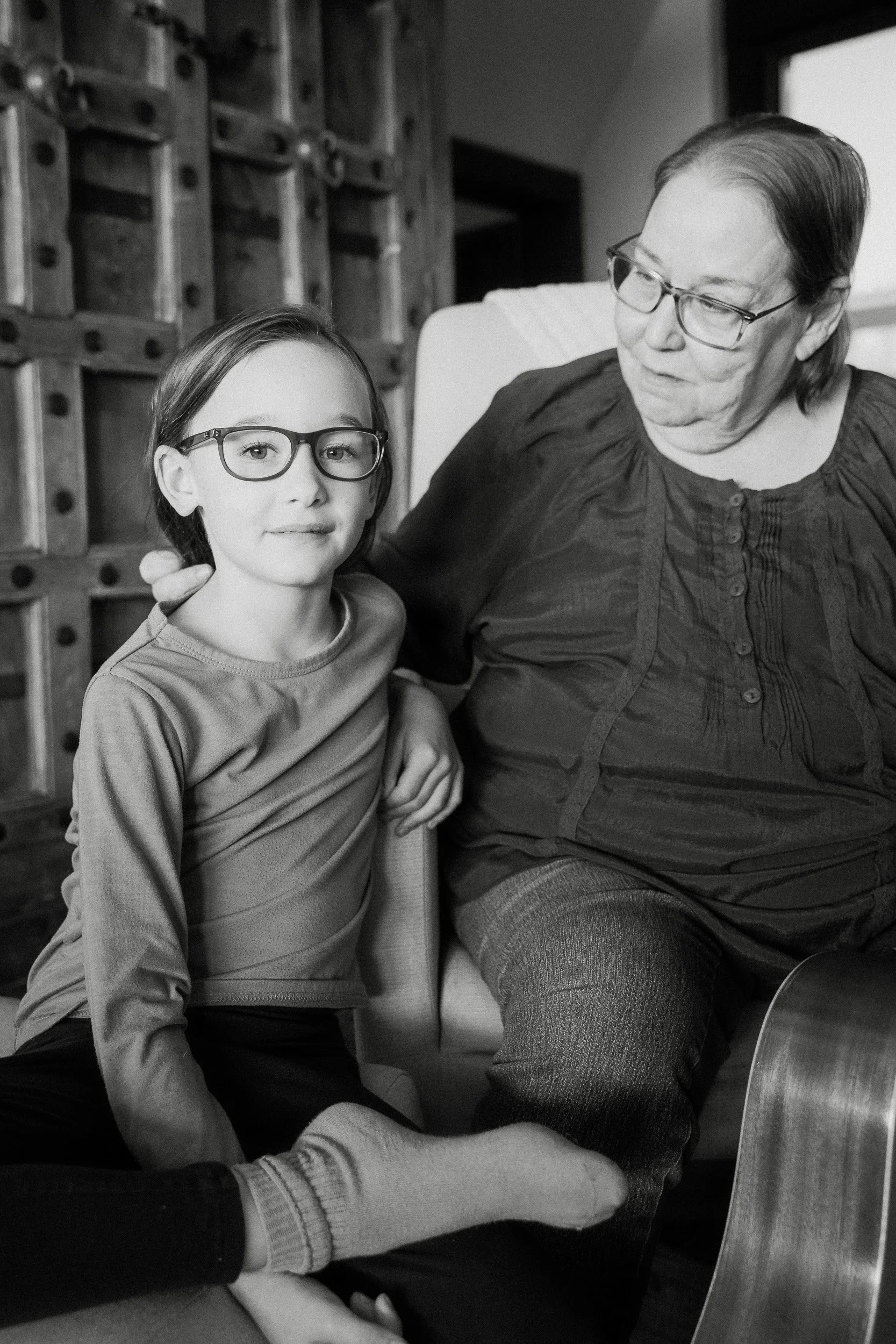  grammy and grandchild embrace during a family photo session in tucson 