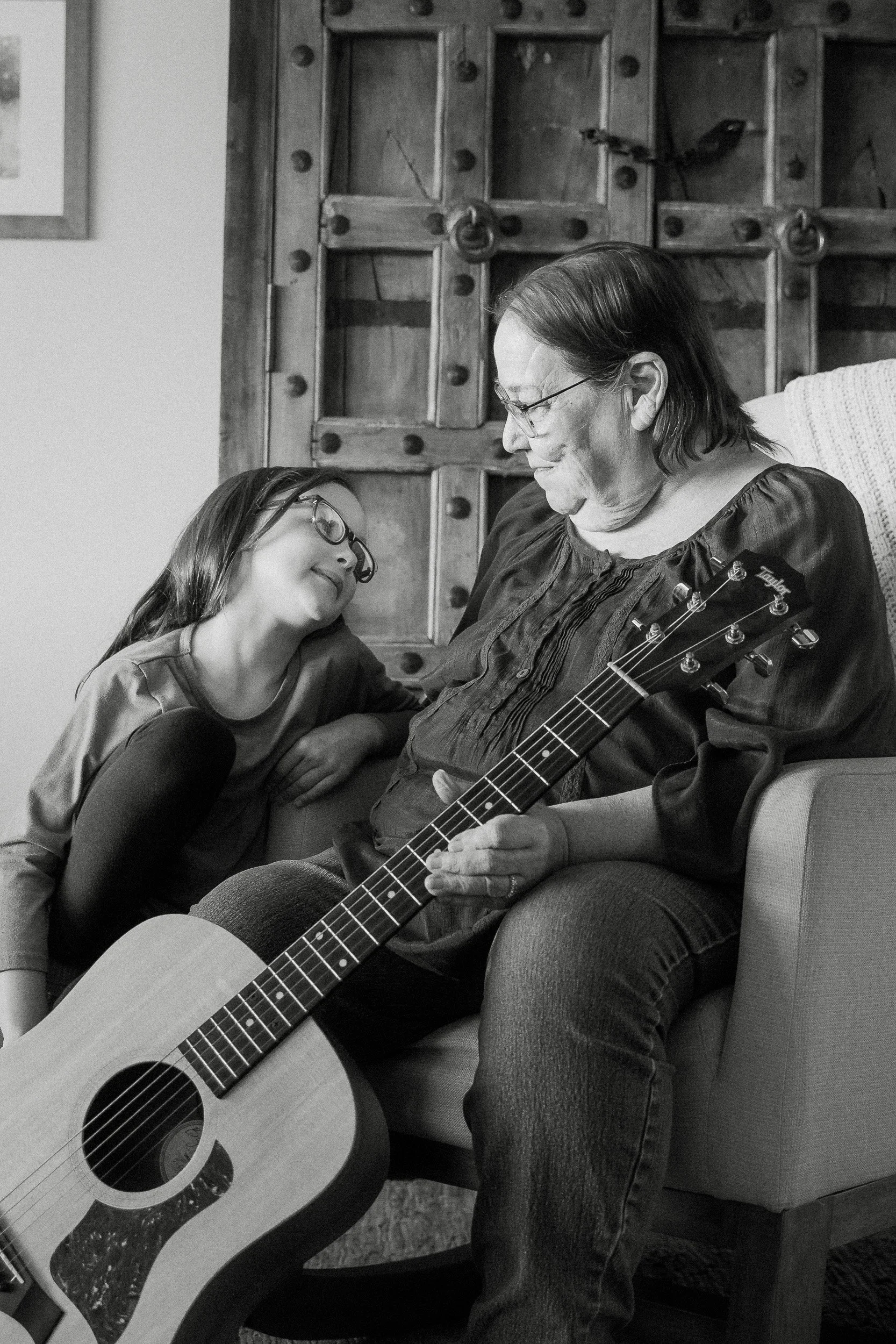  playing guitar during a family photo session with grandparents in tucson 