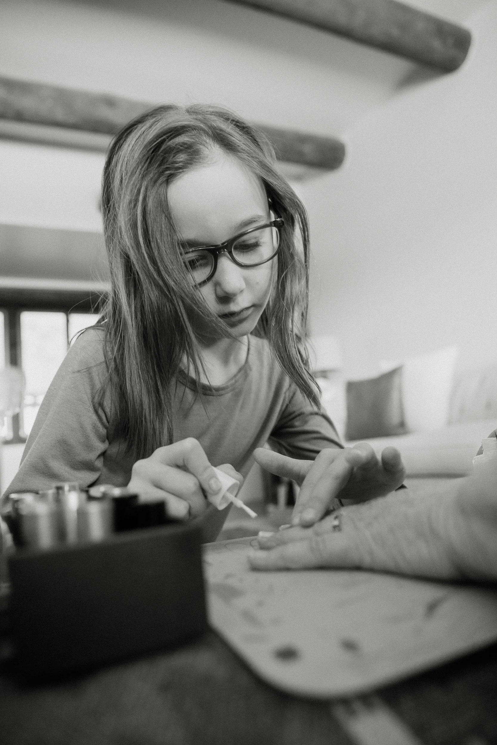  granddaughter paints Grammy’s nails during an at home family photo shoot in tucson 