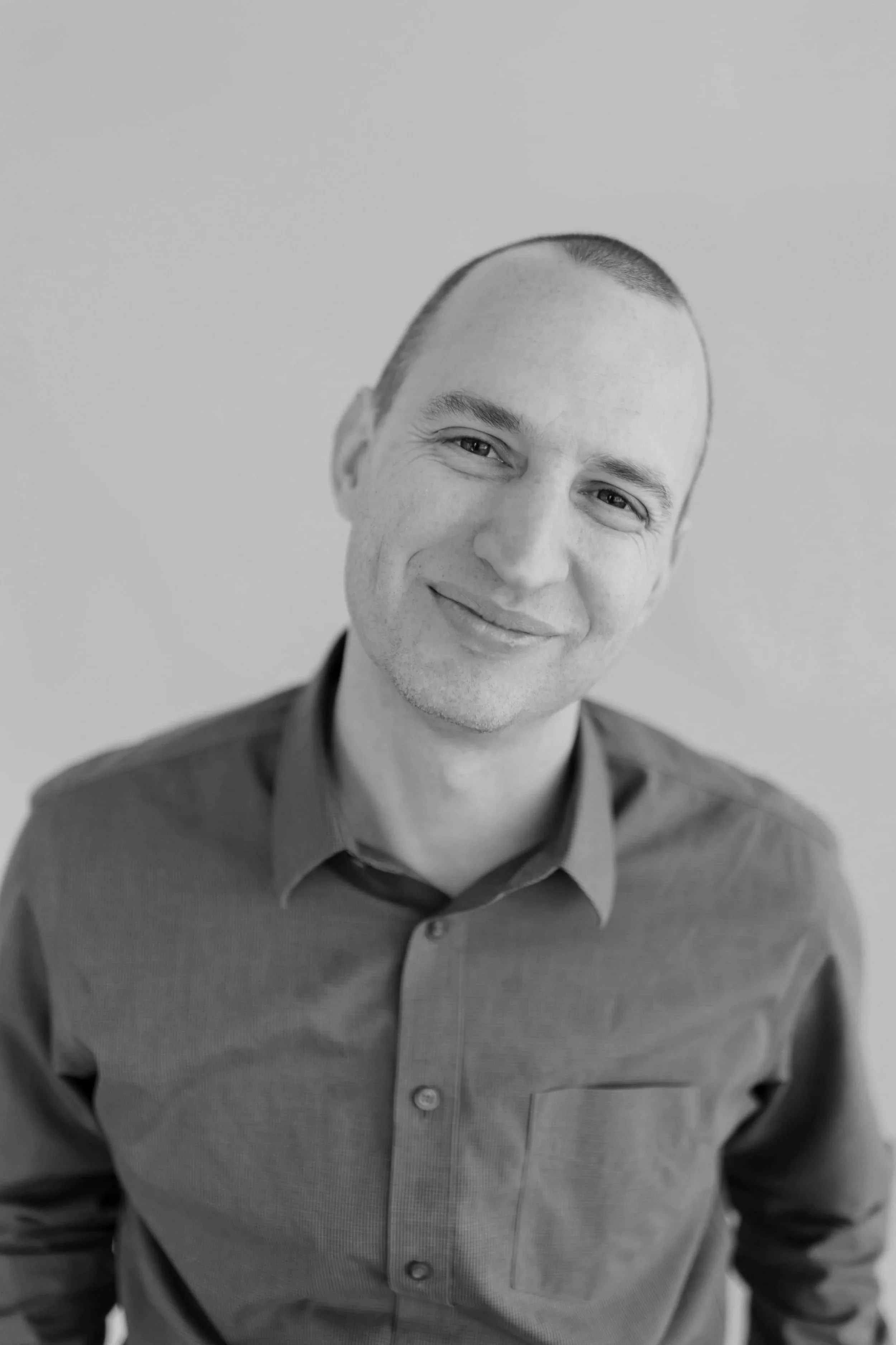 Black and white portrait of Jim Perona, classical guitarist and keynote speaker