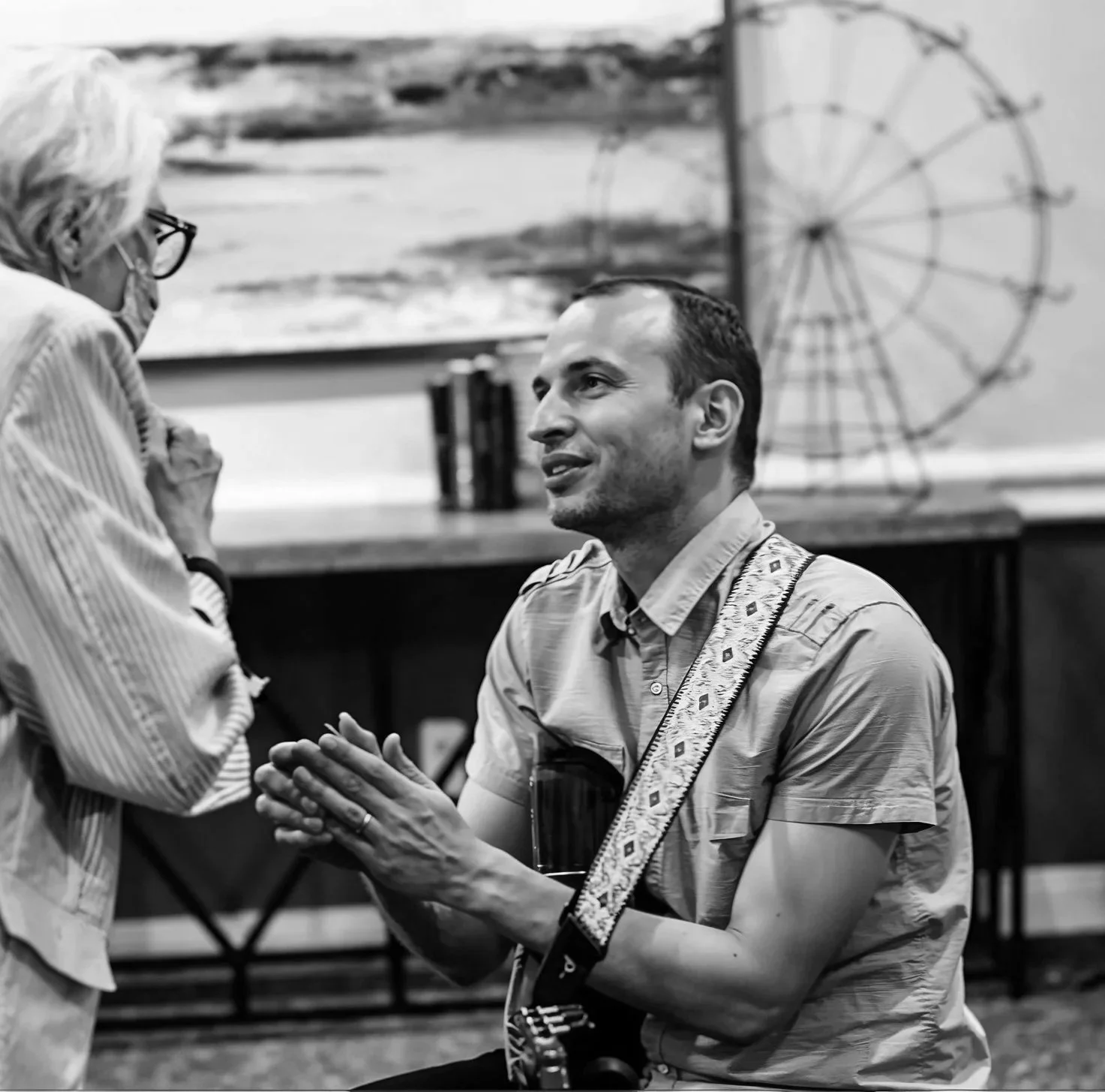 Jim Perona engaging with guests at an intimate house concert