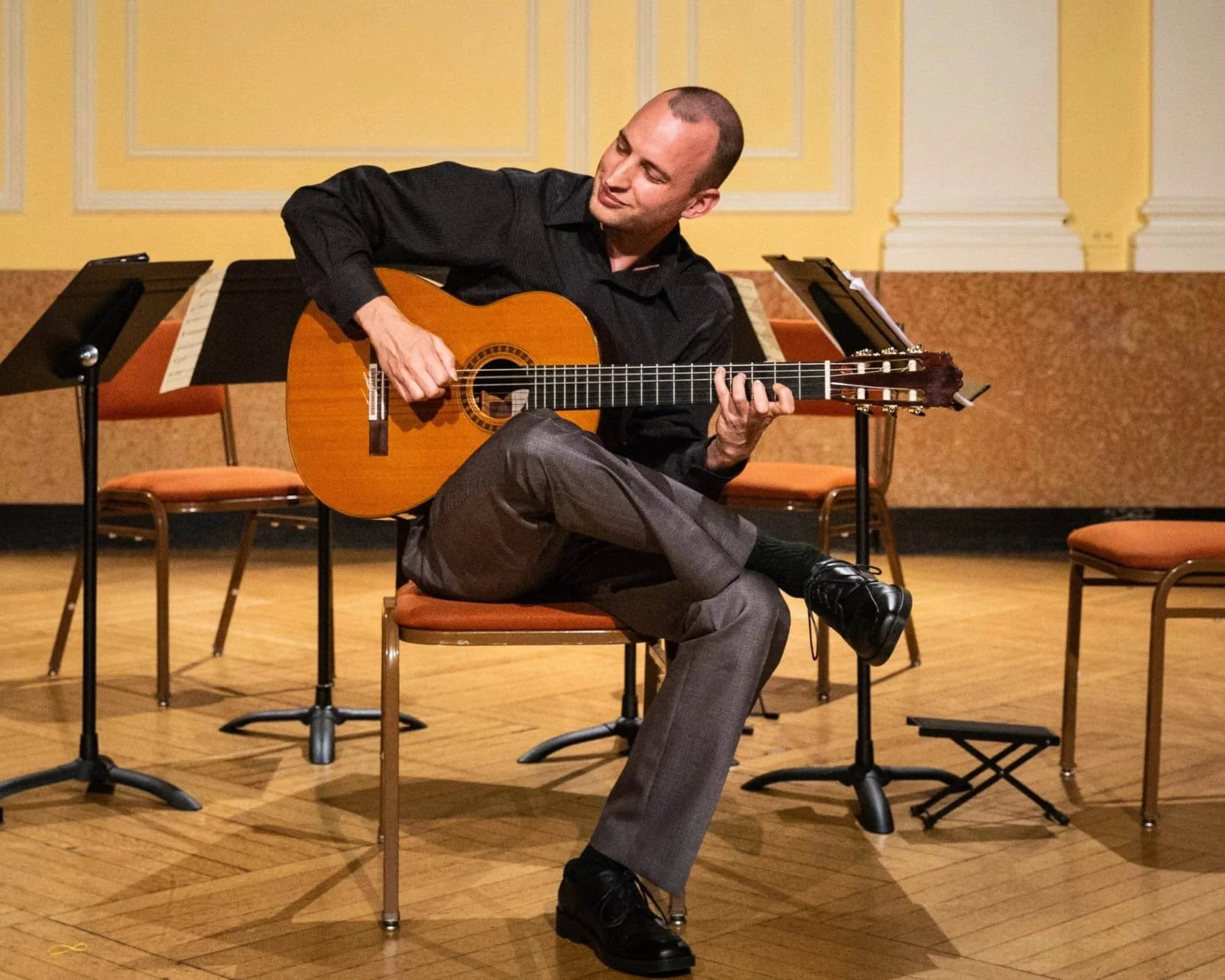 House concert host photo accompanying five-star testimonial