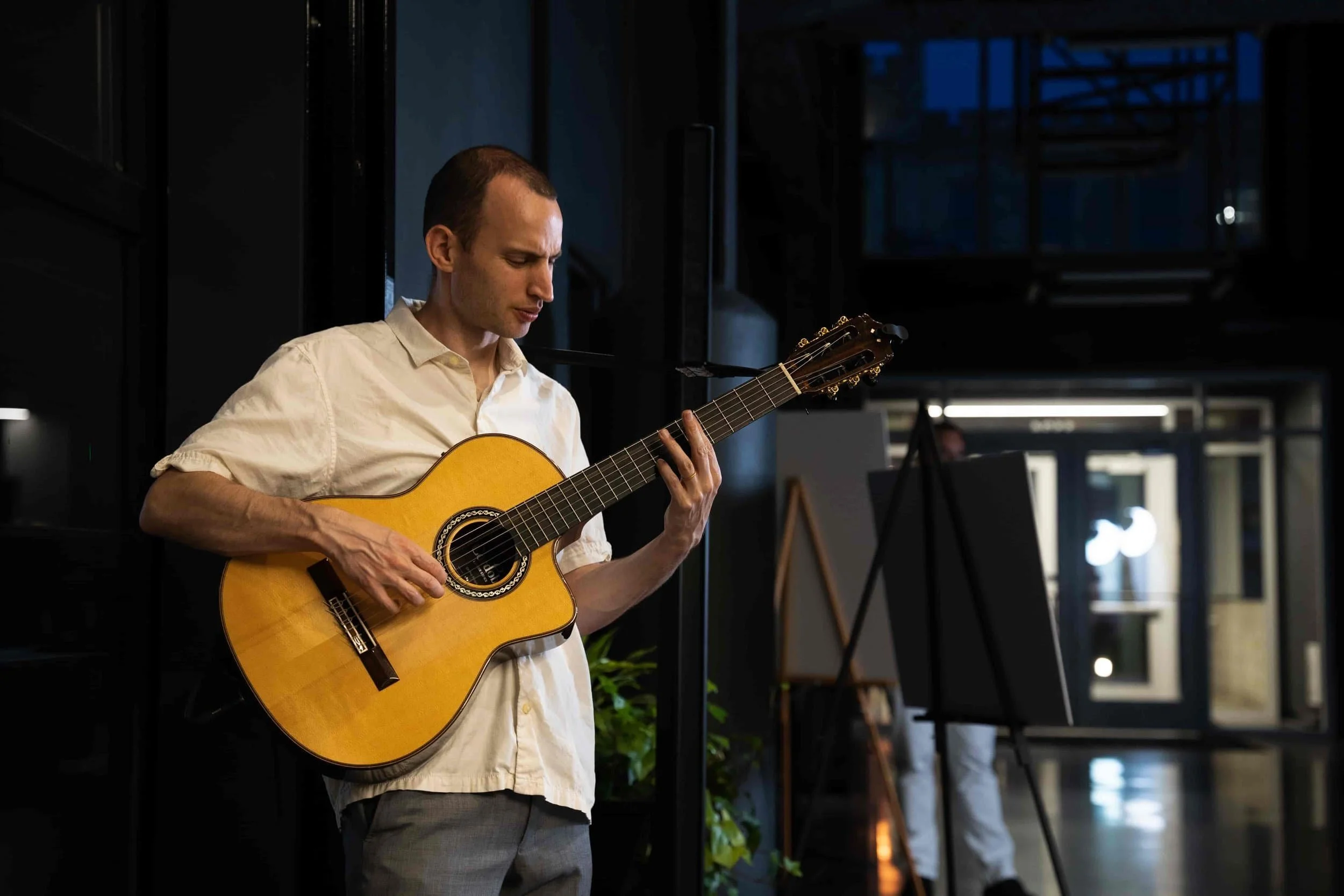 Jim performing on a stage at a corporate event setting