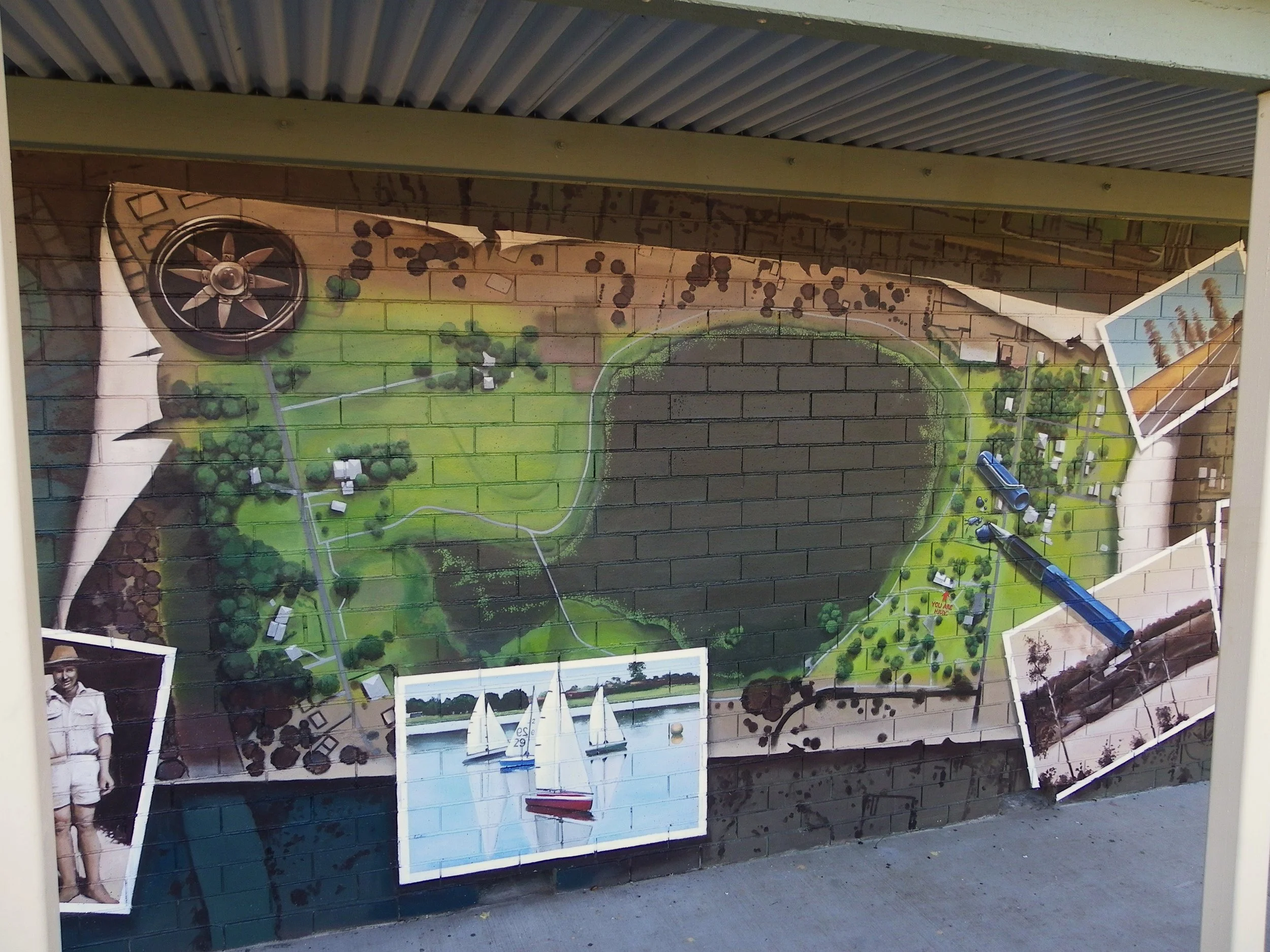 The first of 2 murals depicting a map and historical photos of the area at Tygum Lagoon, to the south of Brisbane.