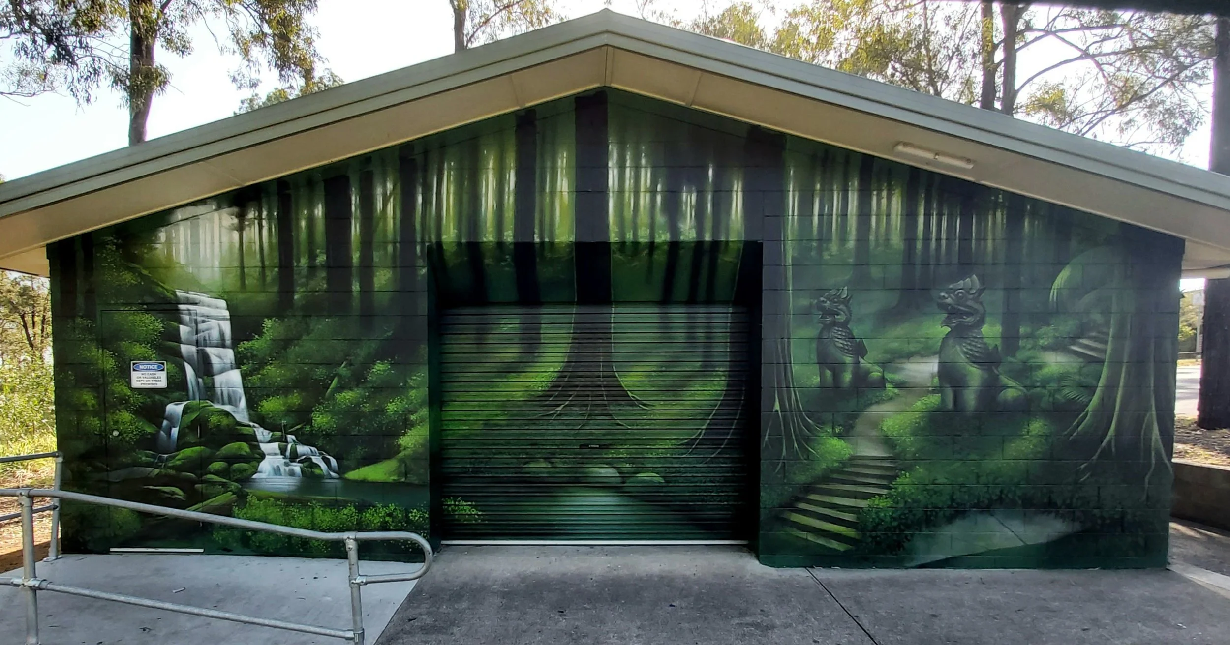 Rainforest scene painted with waterfall at a park in Kingston to the south of Brisbane.