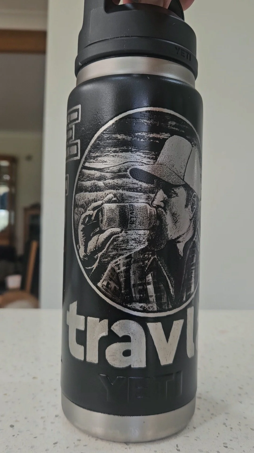 1 of 4 scratch etched water bottles, for a charity called a "Long drive for drought". 2026