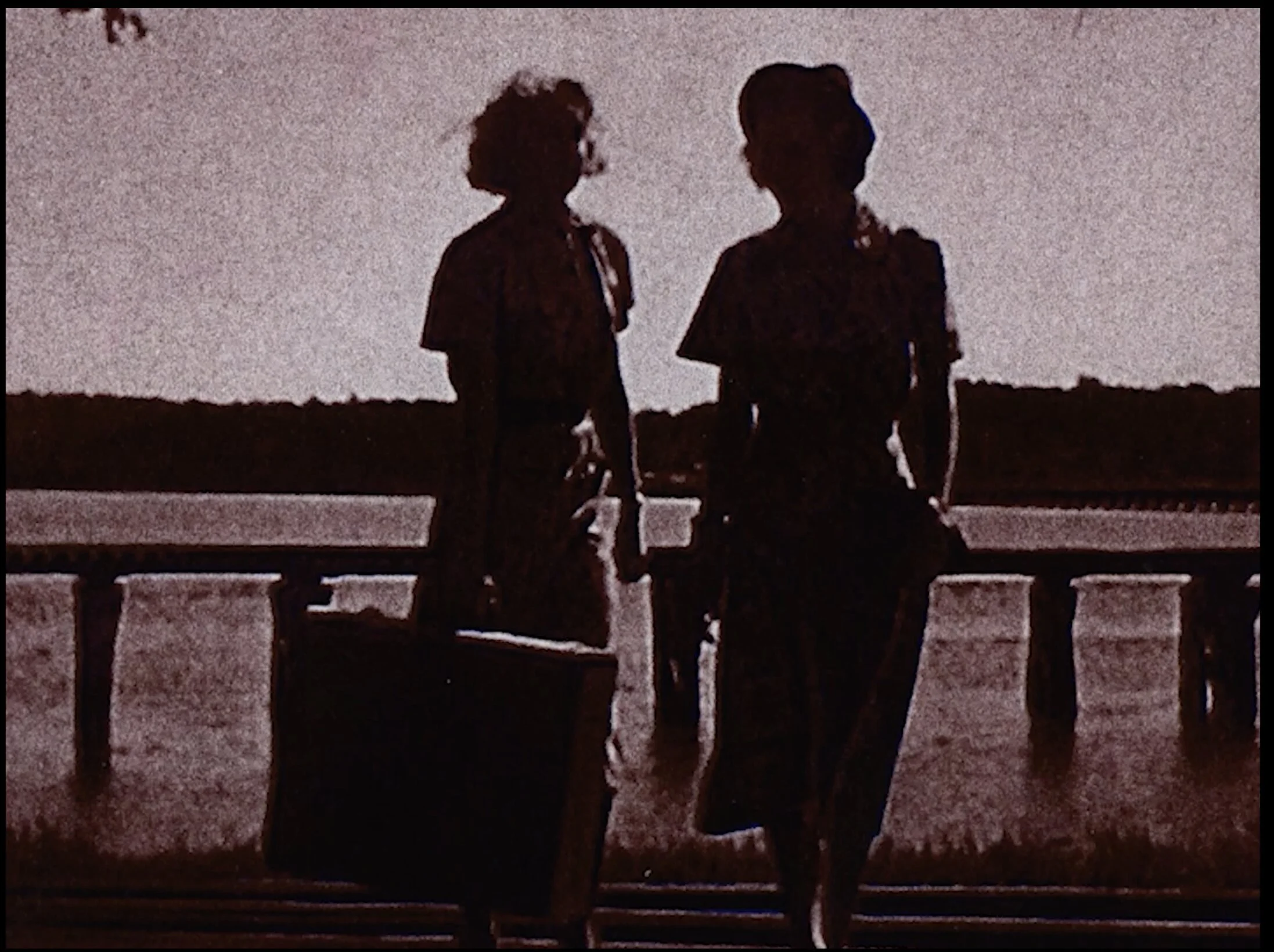 Risograph print of two women in the 1940s arriving at a train station in Wiscasset, Maine.