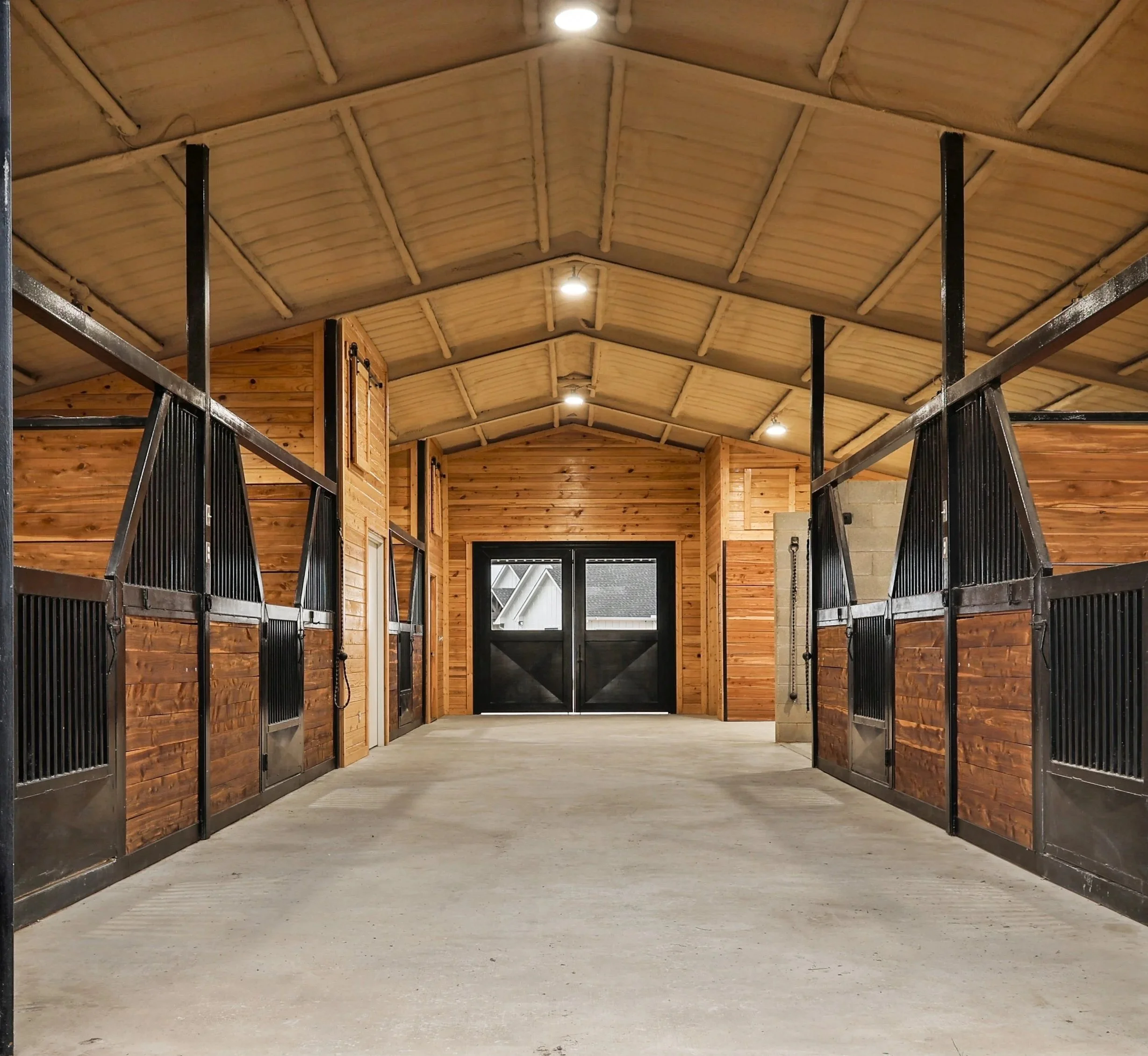 Custom horse barn stalls at Stramel Ranch horse ranch in Pilot Point Texas