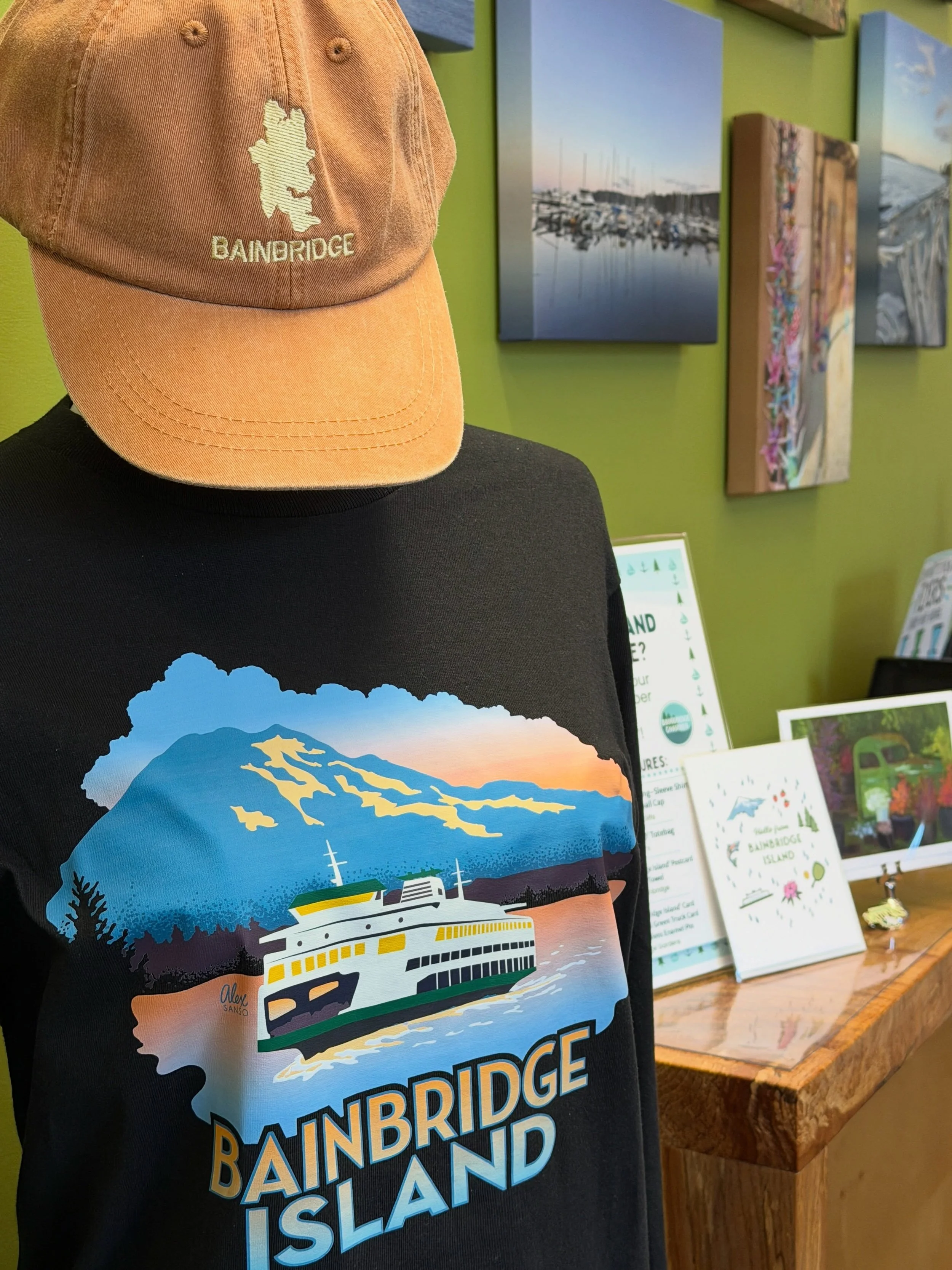 One of the common questions we get asked here at the Chamber Office Visitor Information desk is where visitors can find cool Bainbridge-themed paraphernalia. While it&rsquo;s fun to share lists and point people in the direction of our members who cre