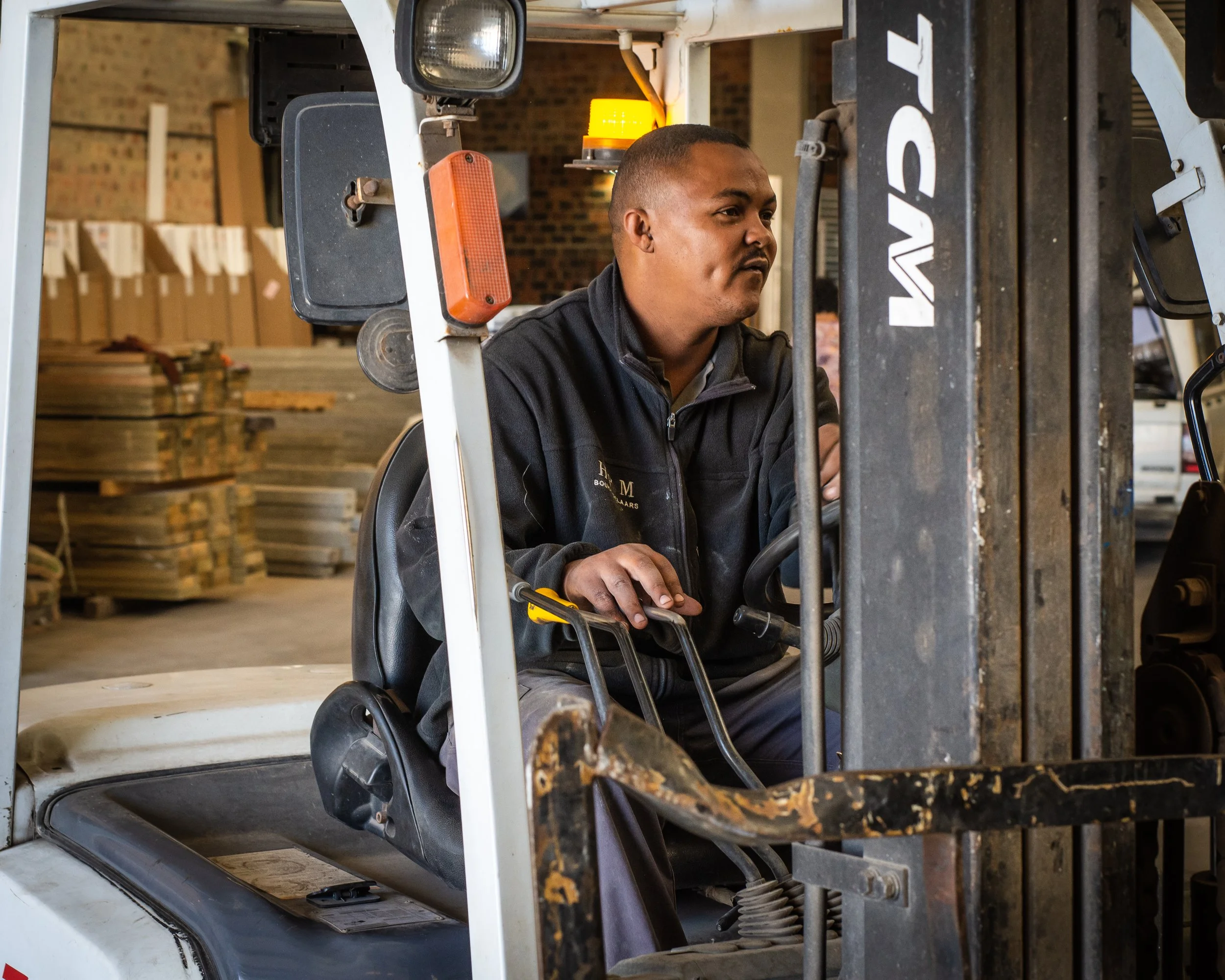 Man operating a forklift in a warehouse