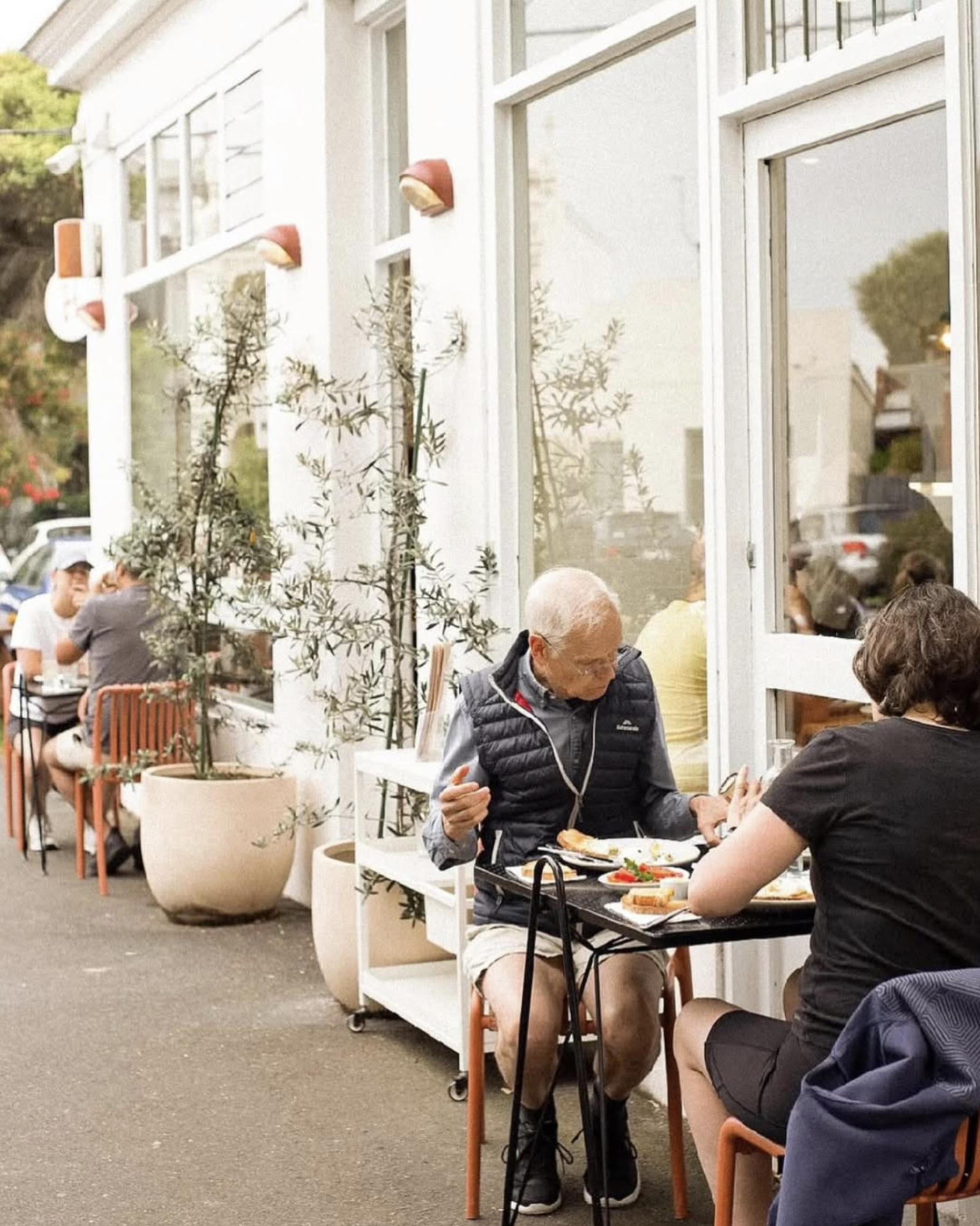 Older couple sitting at an outdoor cafe in Albert Park, Melbourne