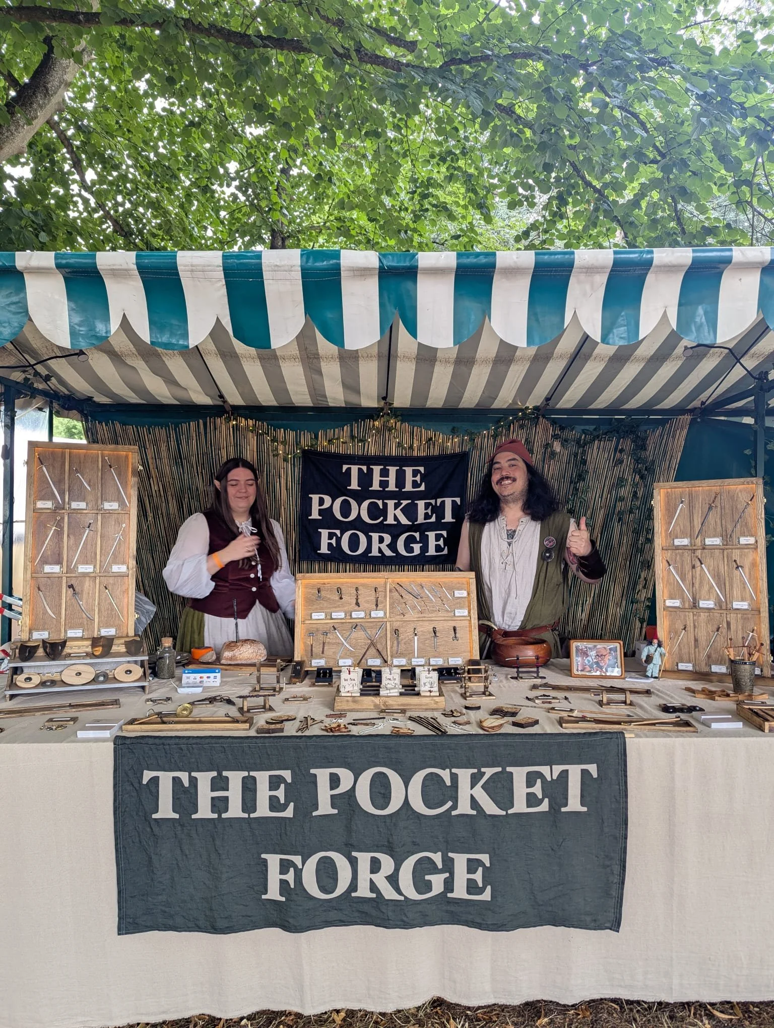 The Pocket Forge, a husband and wife UK small business miniature blacksmith, with their medieval market stall