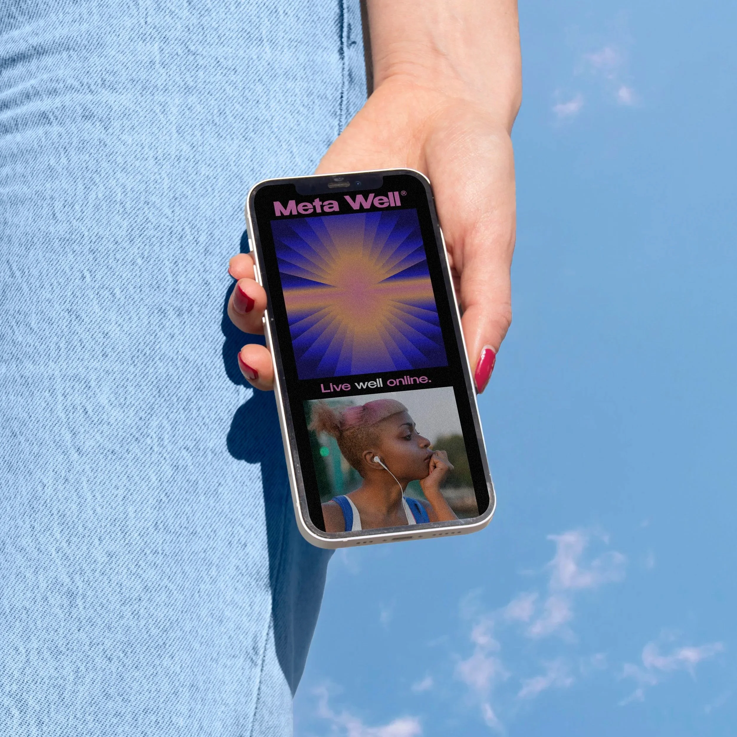 A person holding a smartphone displaying a website called Meta Well, with a radiant sun graphic at the top, the words "Live well online," and a woman listening to music in a video or photo at the bottom.