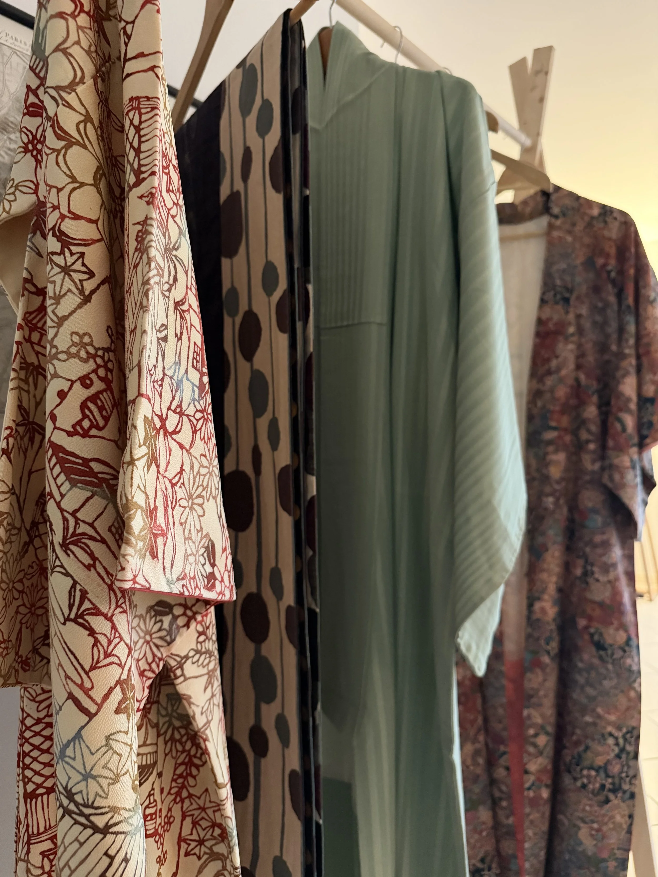 Kimono and Kaori hanging on a rack, including men and women's kimono