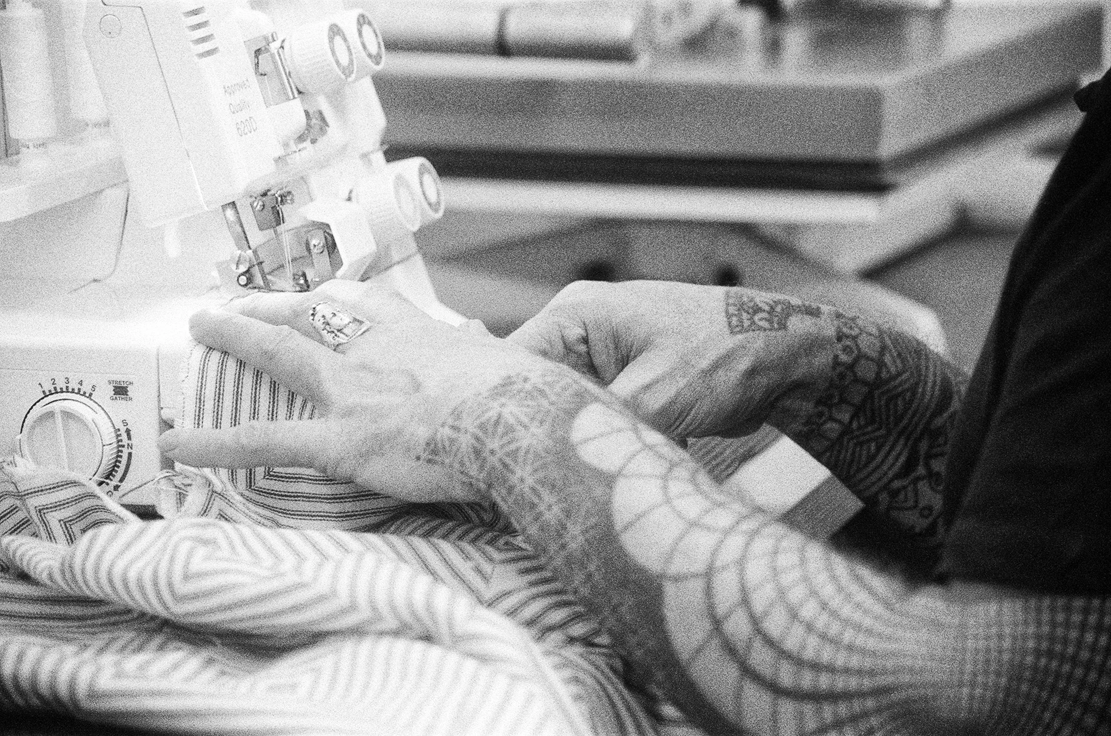 Detail shot of Andi Walker hands at sewing maching