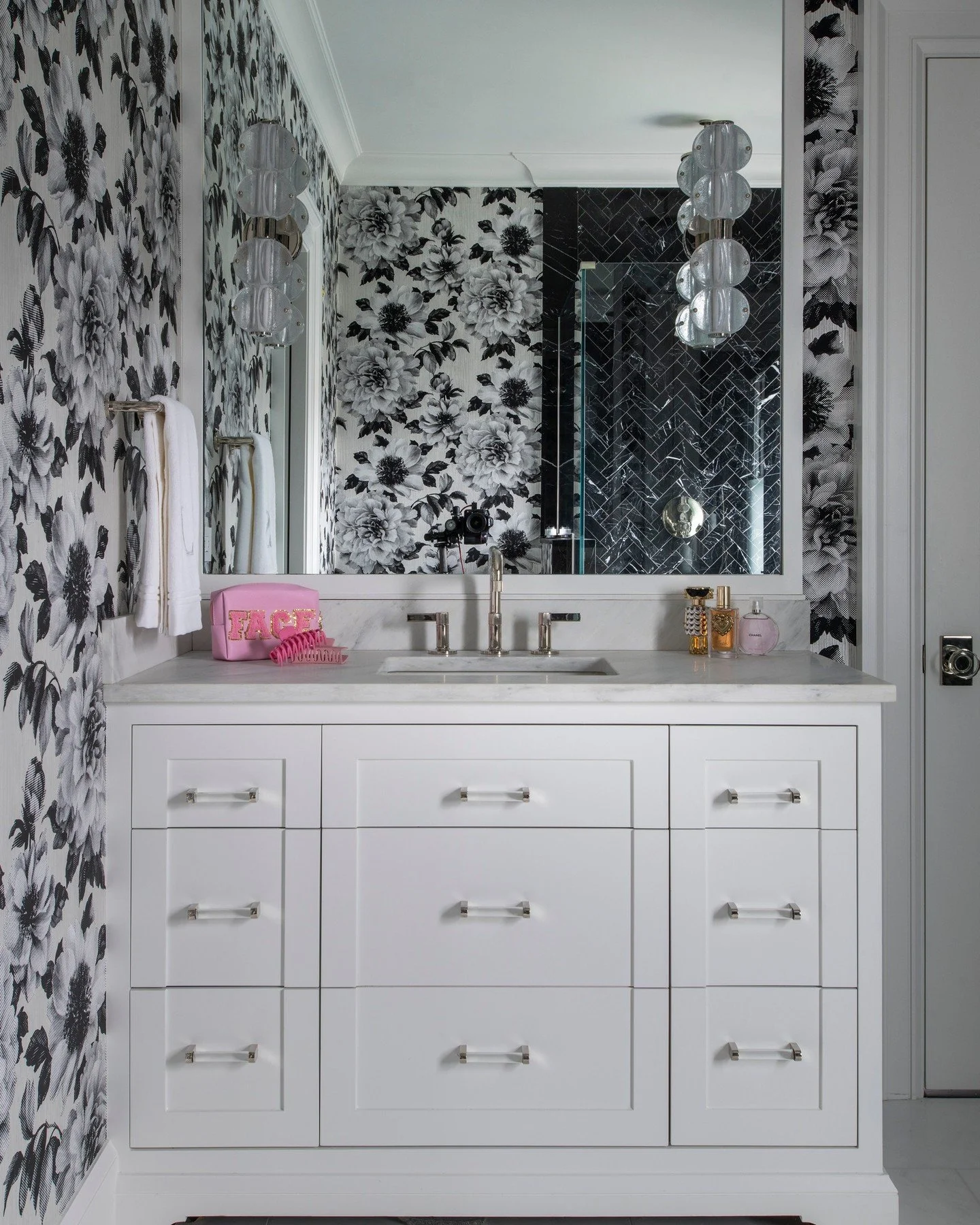 A study in contrast &mdash; bold black marble meets soft floral texture for a bathroom that&rsquo;s both dramatic and feminine.
Every element, from the tailored vanity to the herringbone shower tile, strikes a balance of strength and serenity.
📸: @m