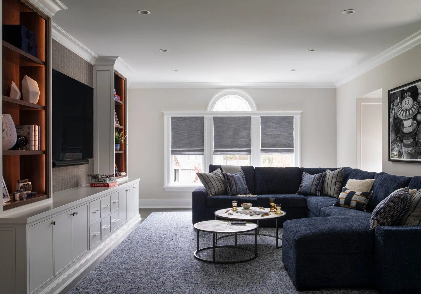 The ultimate bonus room &mdash; part game lounge, part TV retreat, part guest getaway.
Layered textures, deep navy tones, and tailored built-ins create a space that feels as comfortable as it is refined &mdash; the perfect hangout for kids and guests