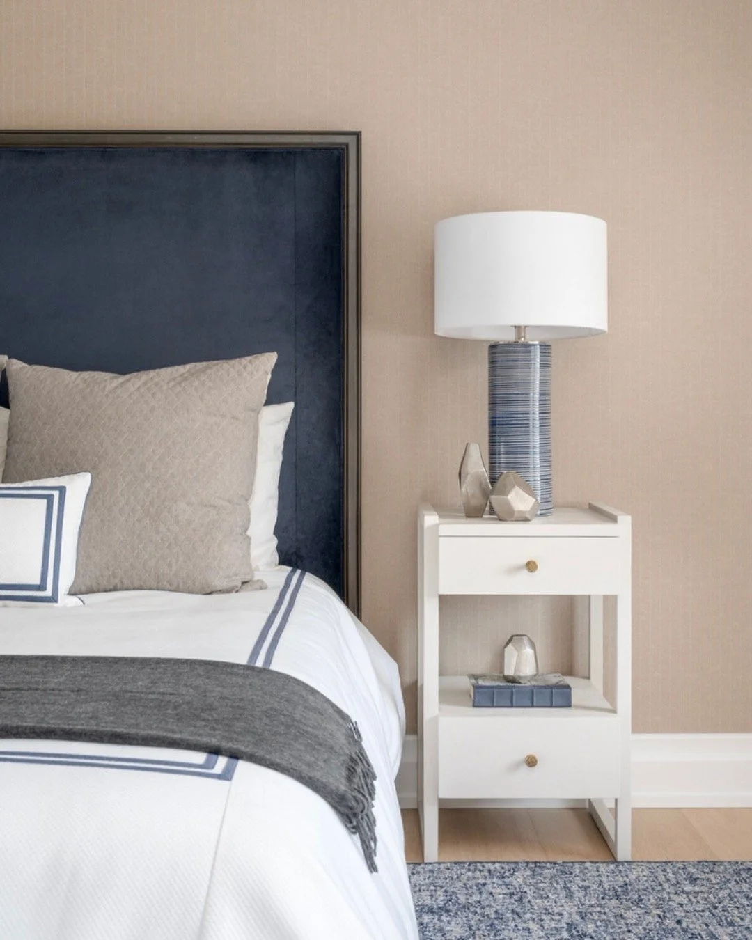 Each guest room was designed with its own distinct personality &mdash; one layered in rich velvets and warm neutrals, the other crisp and tailored with classic navy and white. Different moods, same inviting feel. ✨🛏️ 
📸: @timhillphoto