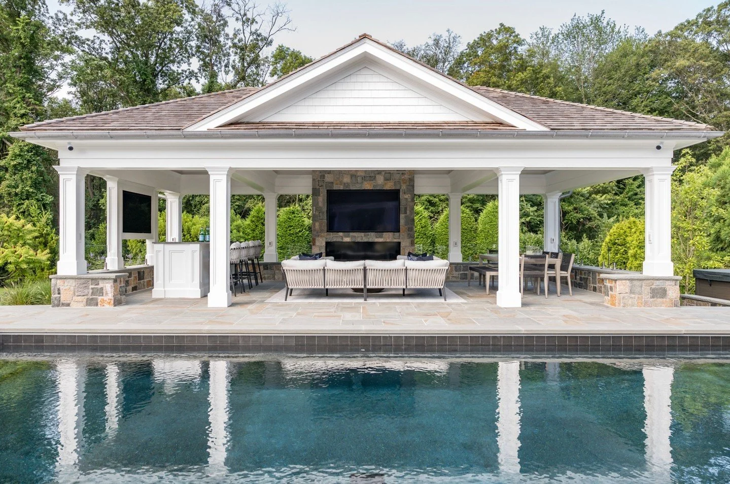 A poolside moment, elevated ✨
This covered cabana was designed to feel like an extension of the home &mdash; refined, inviting, and made for long afternoons that turn into effortless evenings.
A stone fireplace anchors the space and brings warmth as 