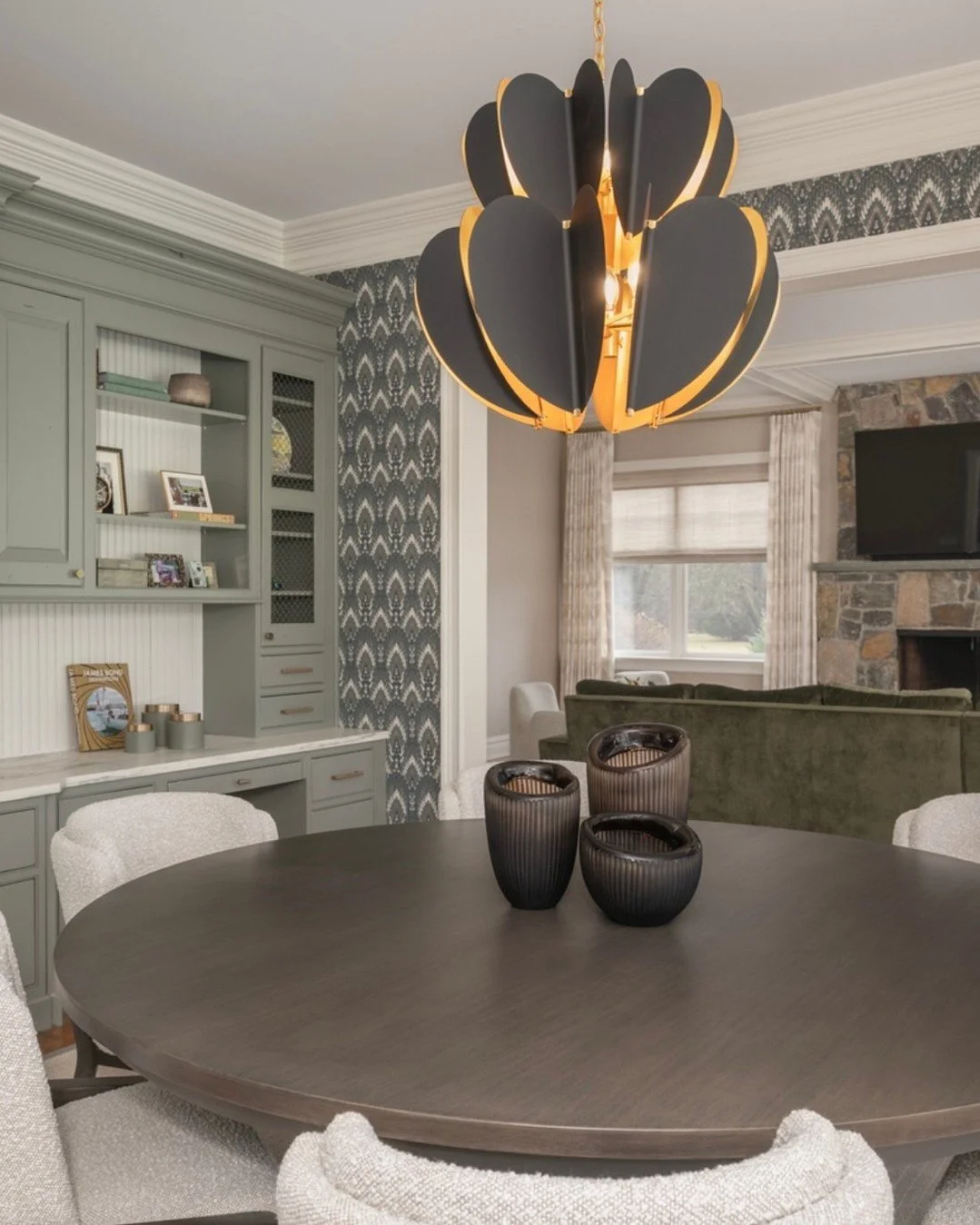 A fresh perspective on a familiar space ✨
We reimagined the existing cabinetry with a soft sage green, giving it new life while preserving the character of the original design. Layered with reeded backing, warm brass hardware, and thoughtfully styled