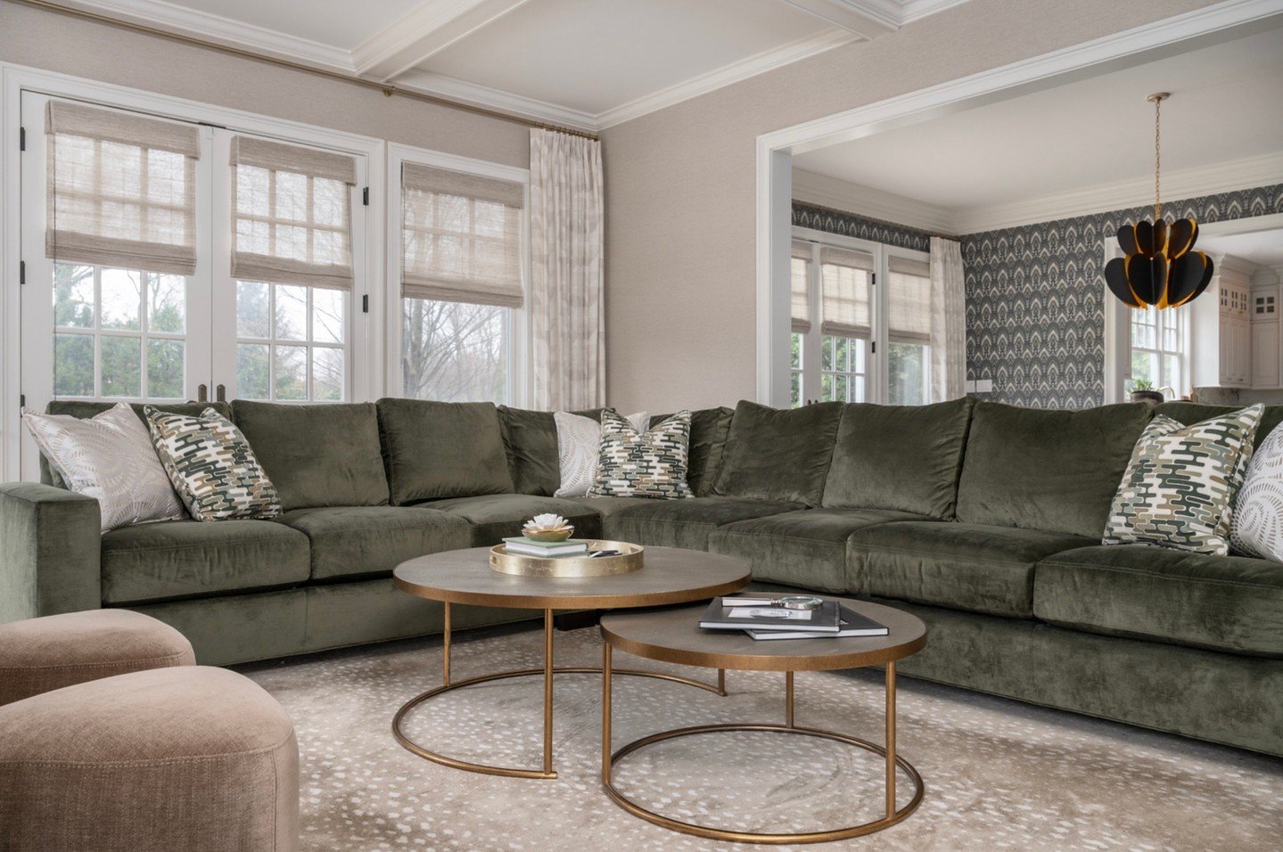 It&rsquo;s all in the details 🤍
From the rich green velvet sectional to the layered mix of patterned and textured pillows, every element was thoughtfully selected to add depth and warmth. The soft, tonal rug grounds the space, while mixed metal tabl