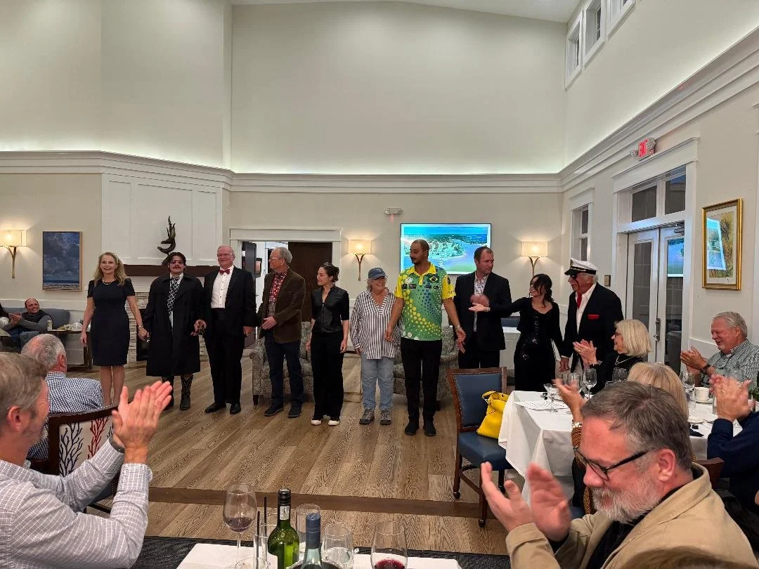 A cast taking a bow after a play.