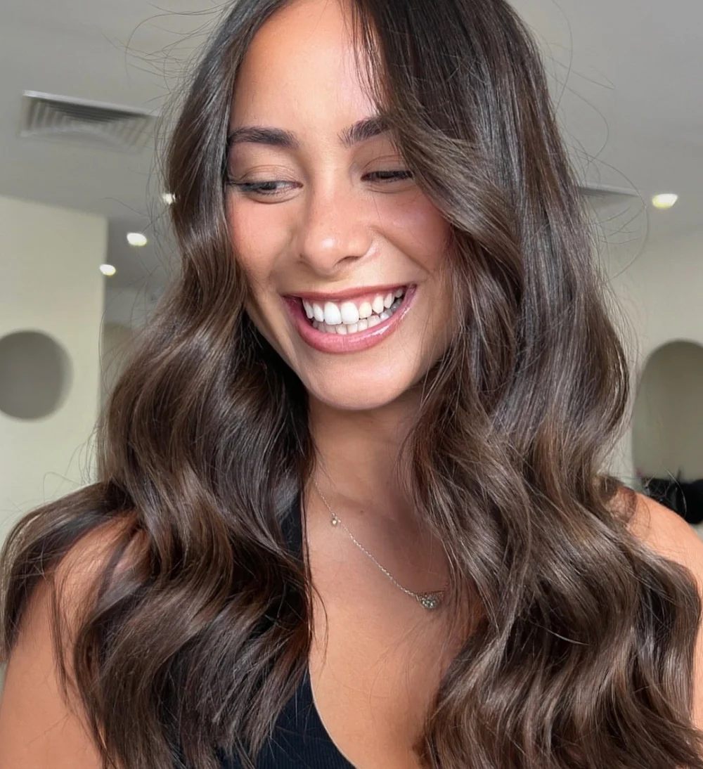 Dimensional brunette hair created at Studio REMMI