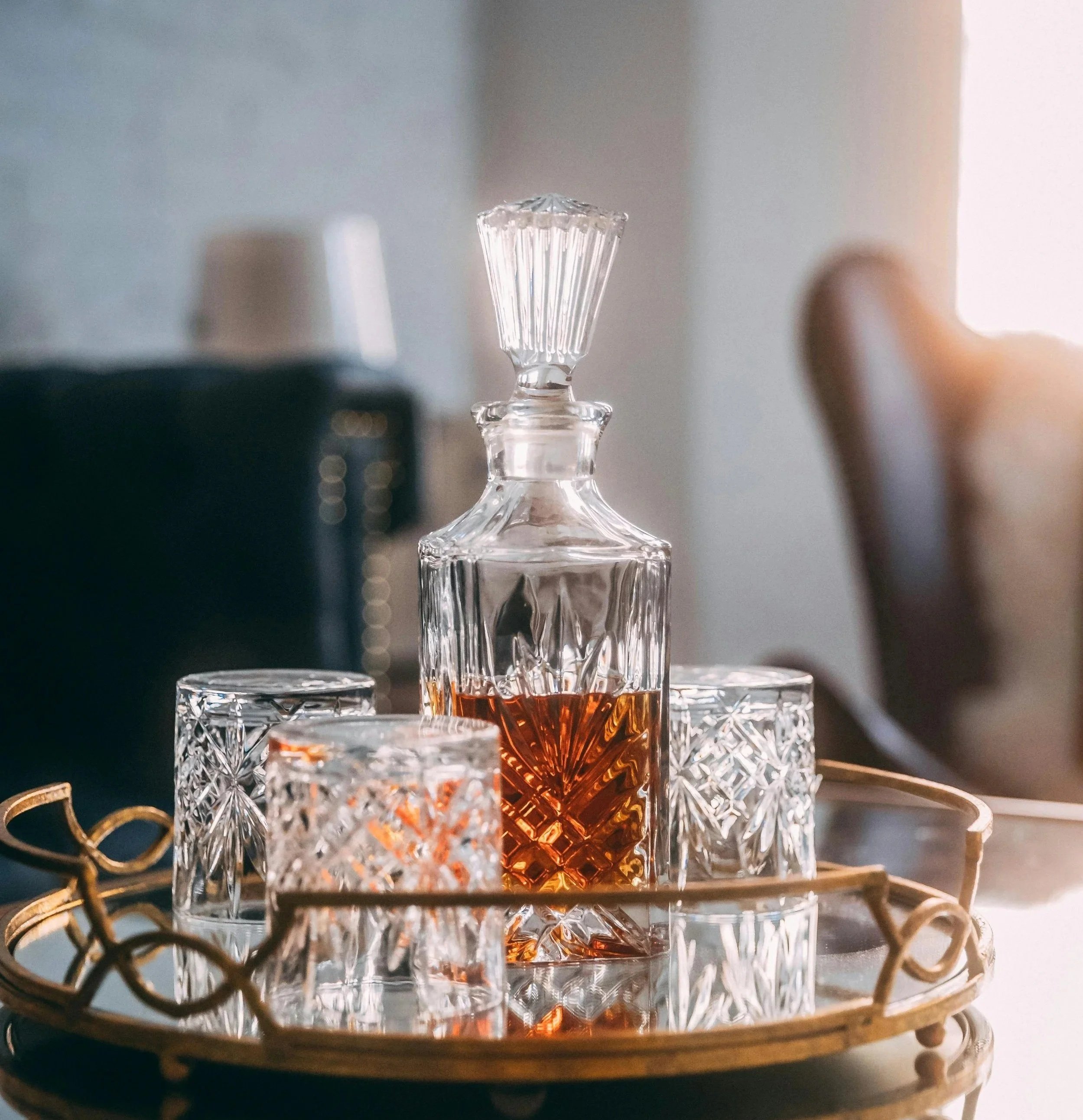 Whiskey in carafe on table - Serena Jones luxury escort Cape Town