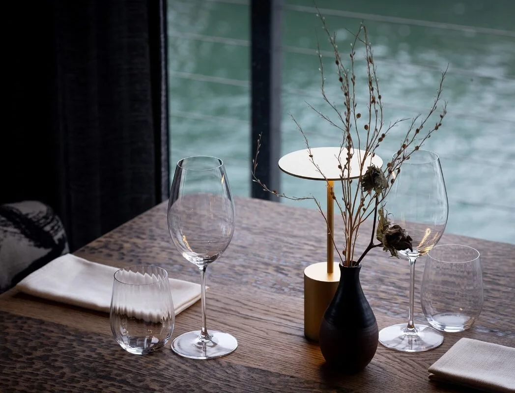 Prepared fine dining dinner for two table by the waterfront seaside - Serena Jones luxury escort Cape Town