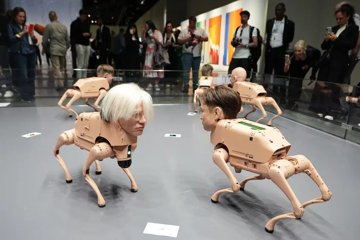 ART BASEL, FACE-TO-FACE WITH ITS OWN CIRCUS: BEEPLE’S ROBOT DOGS EXPOSE THE ART MARKET’S DECAY