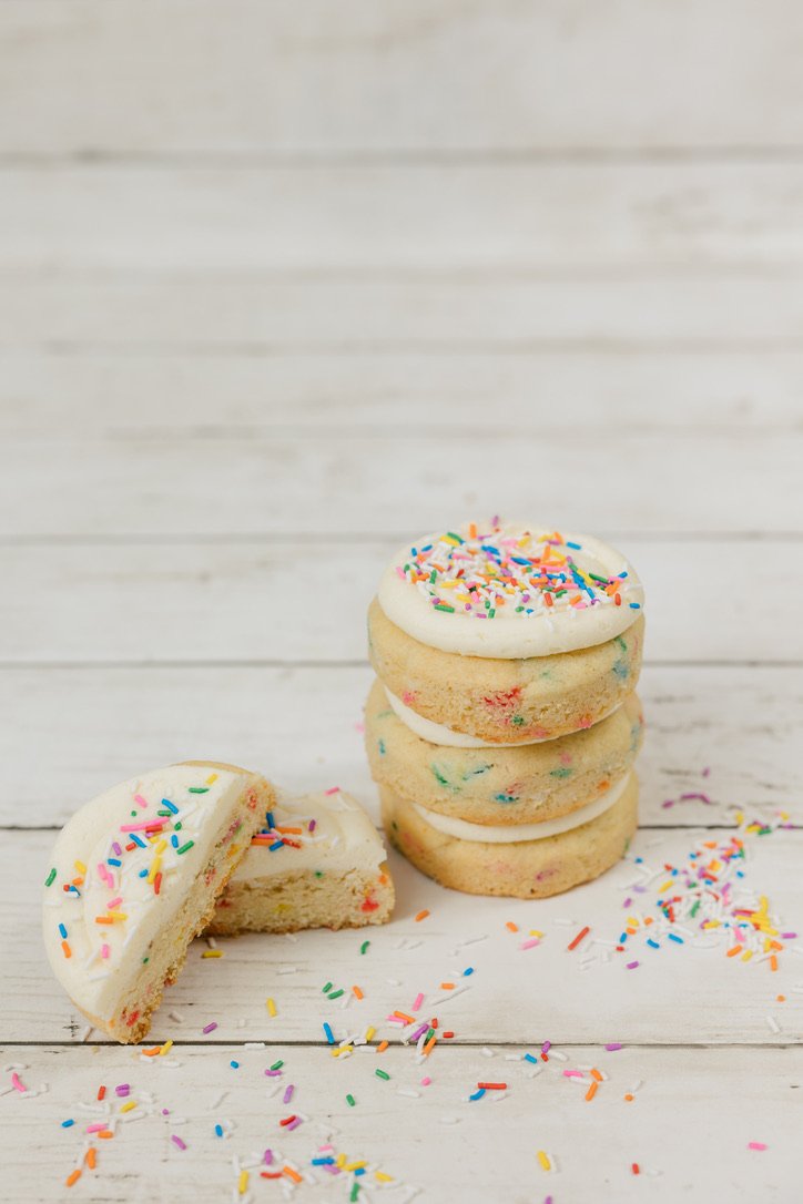 Birthday Cake - Soft, cake batter flavoured sugar cookie filled with sprinkles, topped with cake batter icing and more sprinkles.