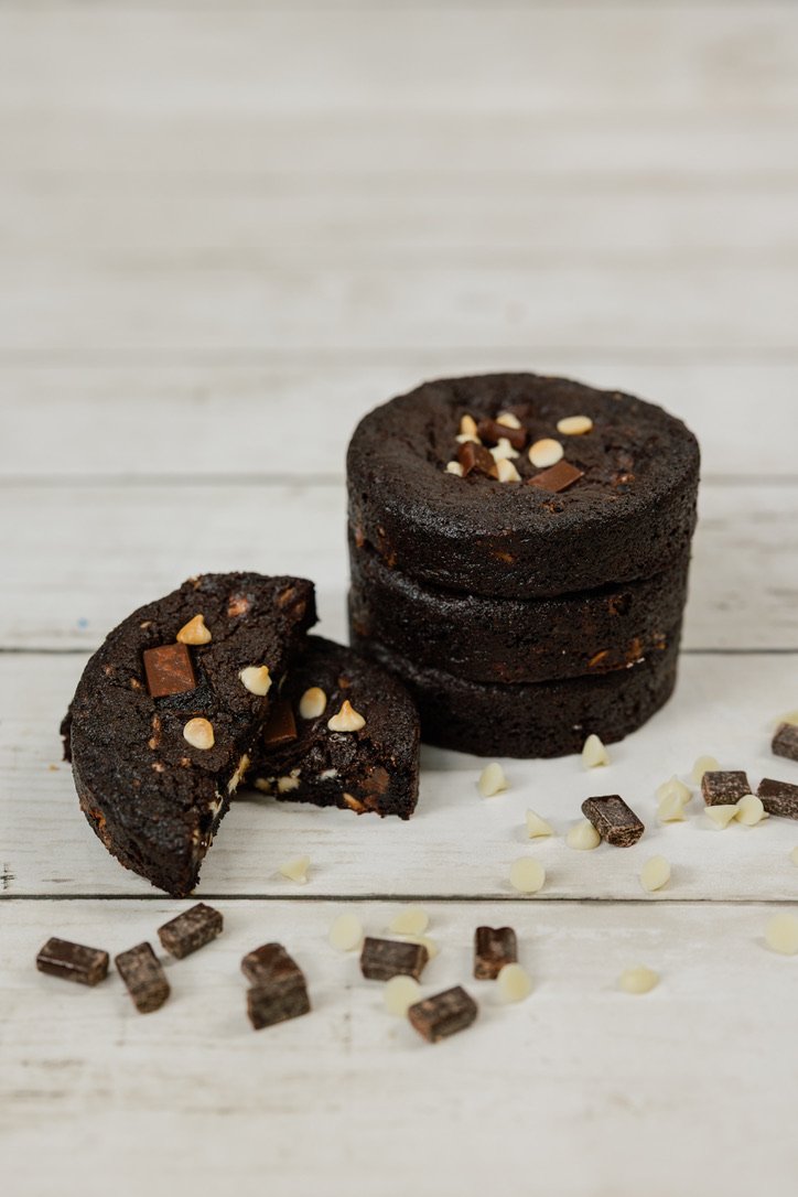 Triple Chocolate - Rich chocolate cookie dough filled with chocolate chunks and white chocolate chips, topped with more chunks and white chips.
