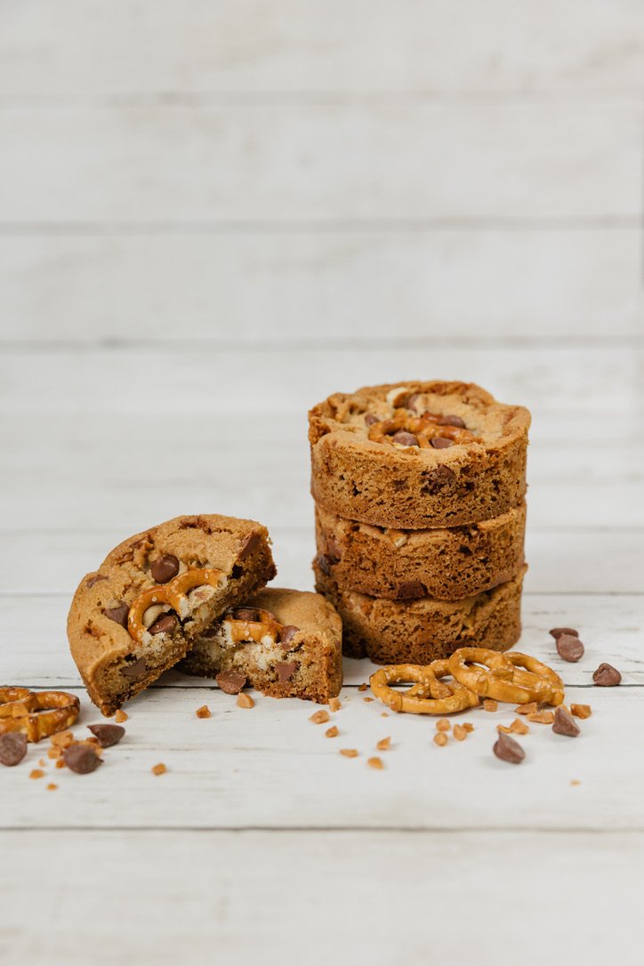 Kitchen Sink - Buttery, brown sugar cookie dough filled with chocolate chips, skor bits and pretzel pieces, topped with some more chocolate chips & skor bits.