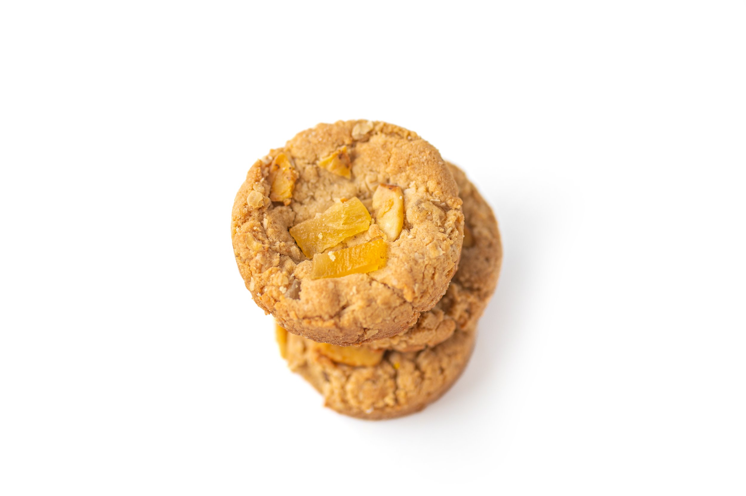 Tropical Oatmeal - Oatmeal cookie lightly kissed with cinnamon and loaded with dried mango, dried pineapple, coconut and dried banana chips, topped with more of the dried fruits!