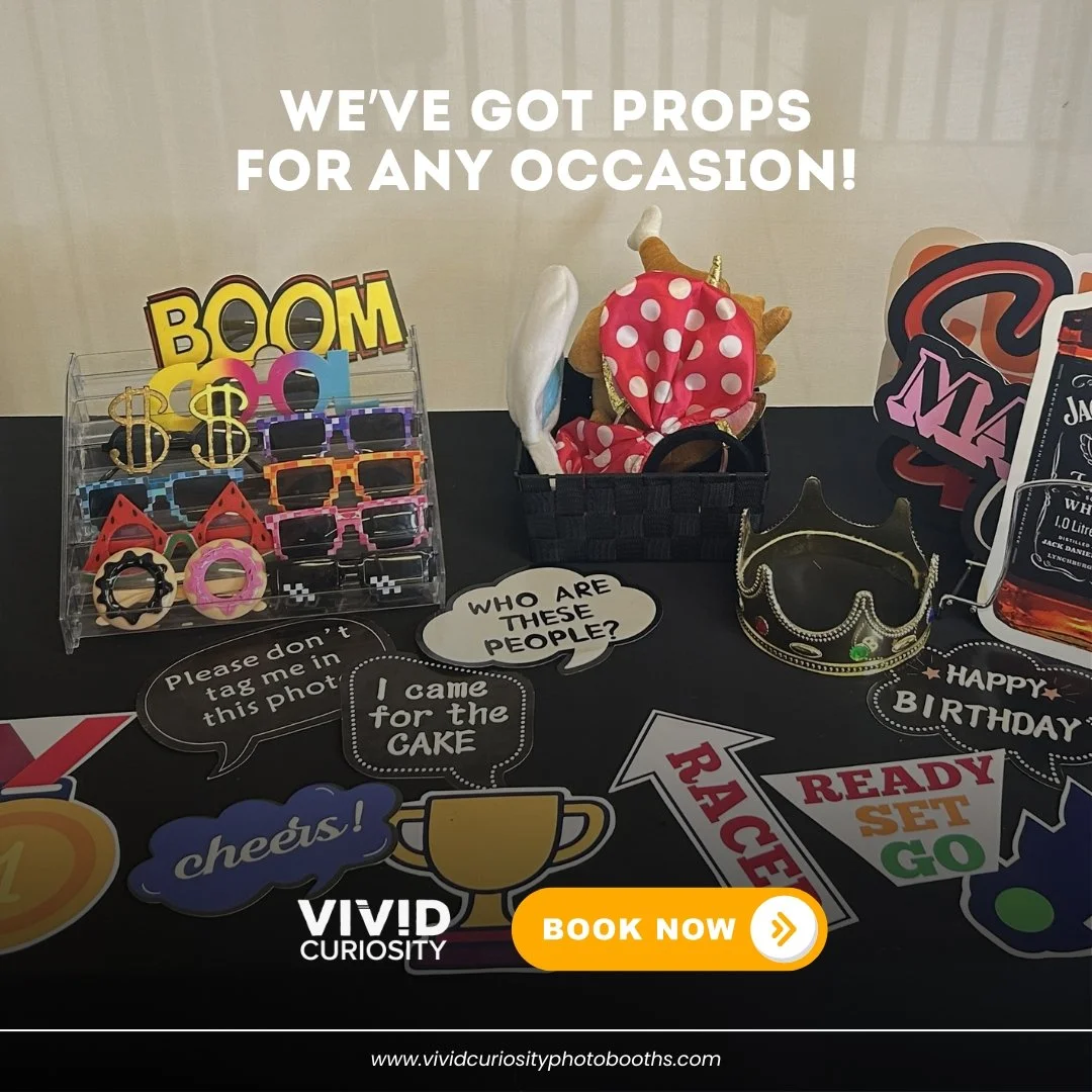 "I came for the cake." Same, honestly. 🎂📸

This is what your guests are working with at a Vivid Curiosity Photobooths event. A full table of props that actually make people laugh before the countdown even starts. Novelty glasses, speech b