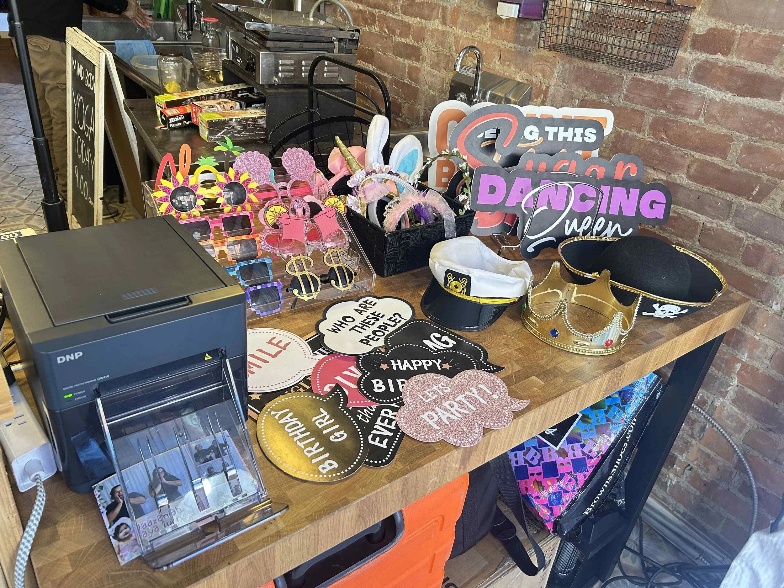 Props, check! Printer, check! We've tested everything before we officially open the booth for guests!