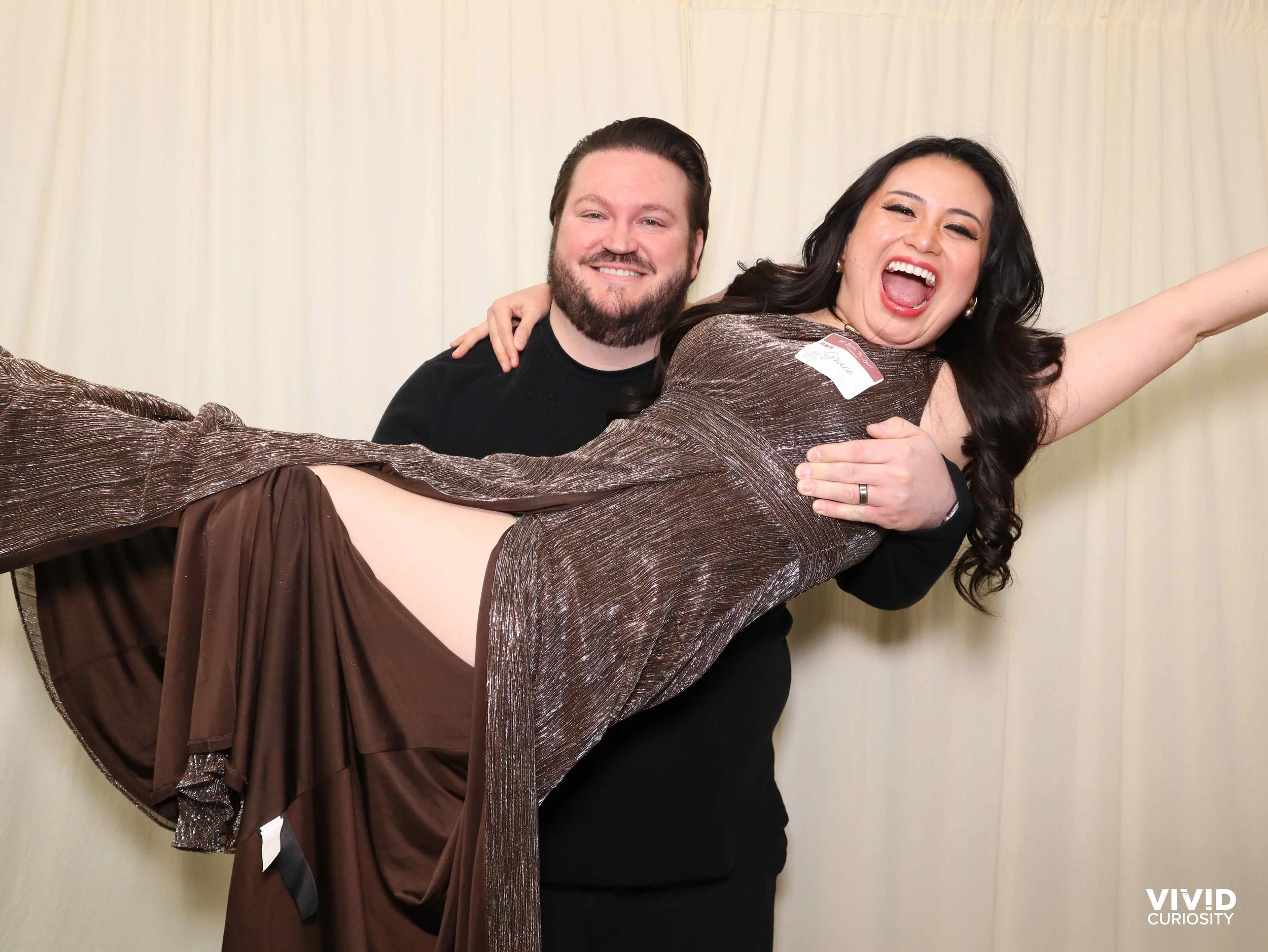 A photo says a million words! A happy couple candidly posing at the camera.