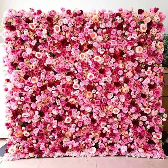 A flower wall provides a bright, textured background that naturally draws guests in for pictures and selfies.