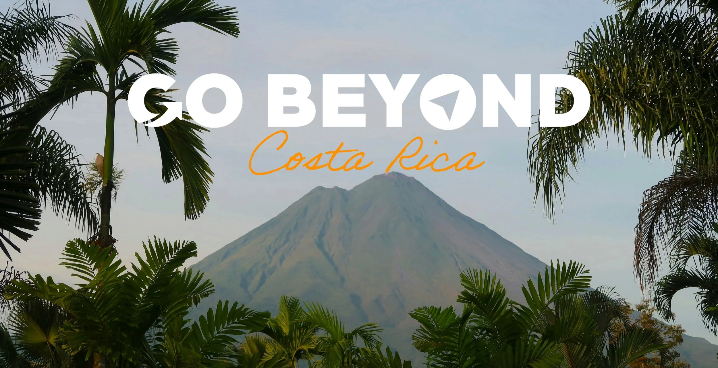 Volcano towering over palm trees with the text "GO BEYOND Costa Rica."