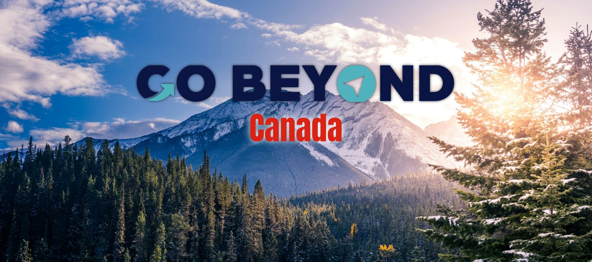 A scenic mountain range and evergreen forest with a text overlay that reads "GO BEYOND Canada."