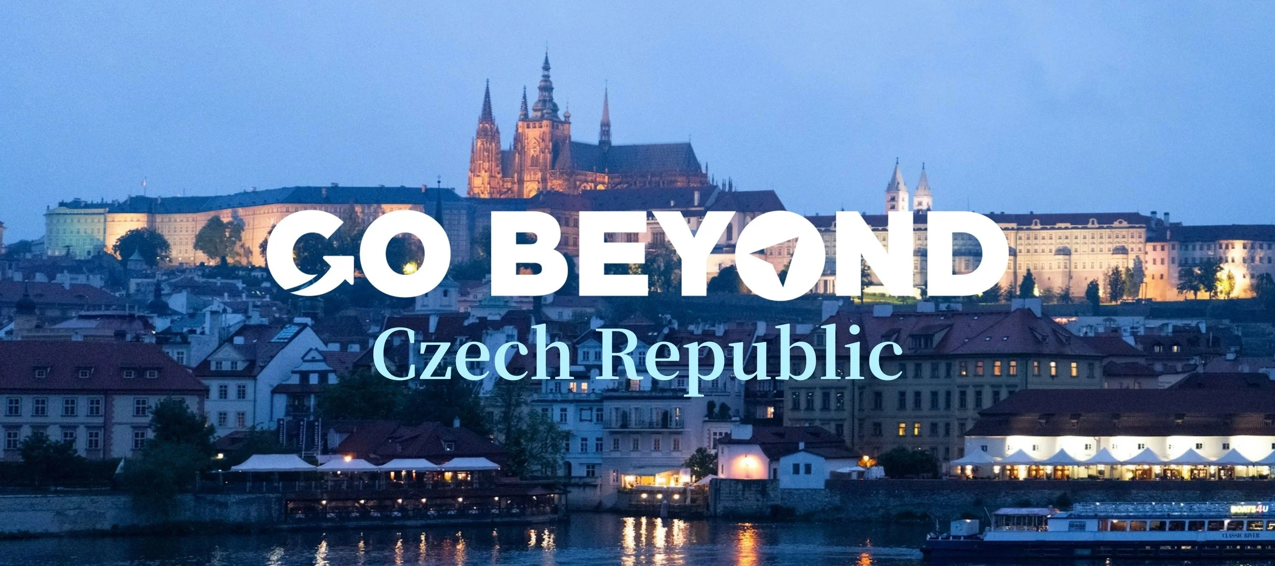 A travel graphic featuring the text "GO BEYOND Czech Republic" overlaid on a dusk skyline of Prague's historic buildings and riverfront.
