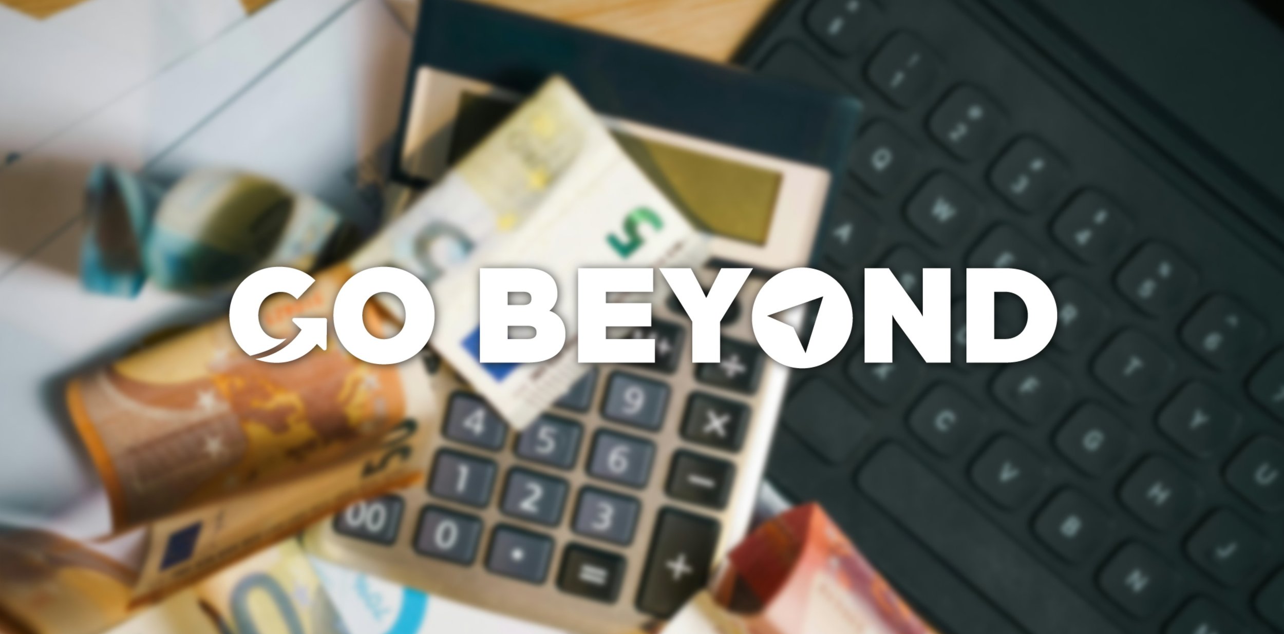 A blurred top-down view of Euro banknotes, a calculator, a document with pie charts, and a laptop keyboard, with the bold white text "GO BEYOND" overlaid in the center.